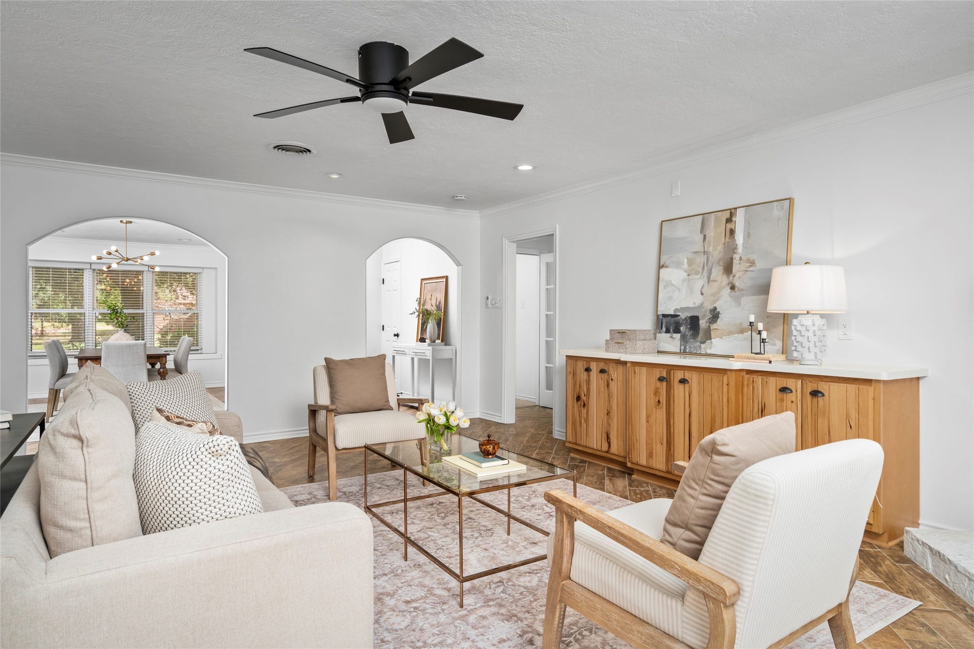 10519 Londonderry Drive, Houston, TX 77043 The inviting and cozy living room sits at the heart of this Shadow Oaks home