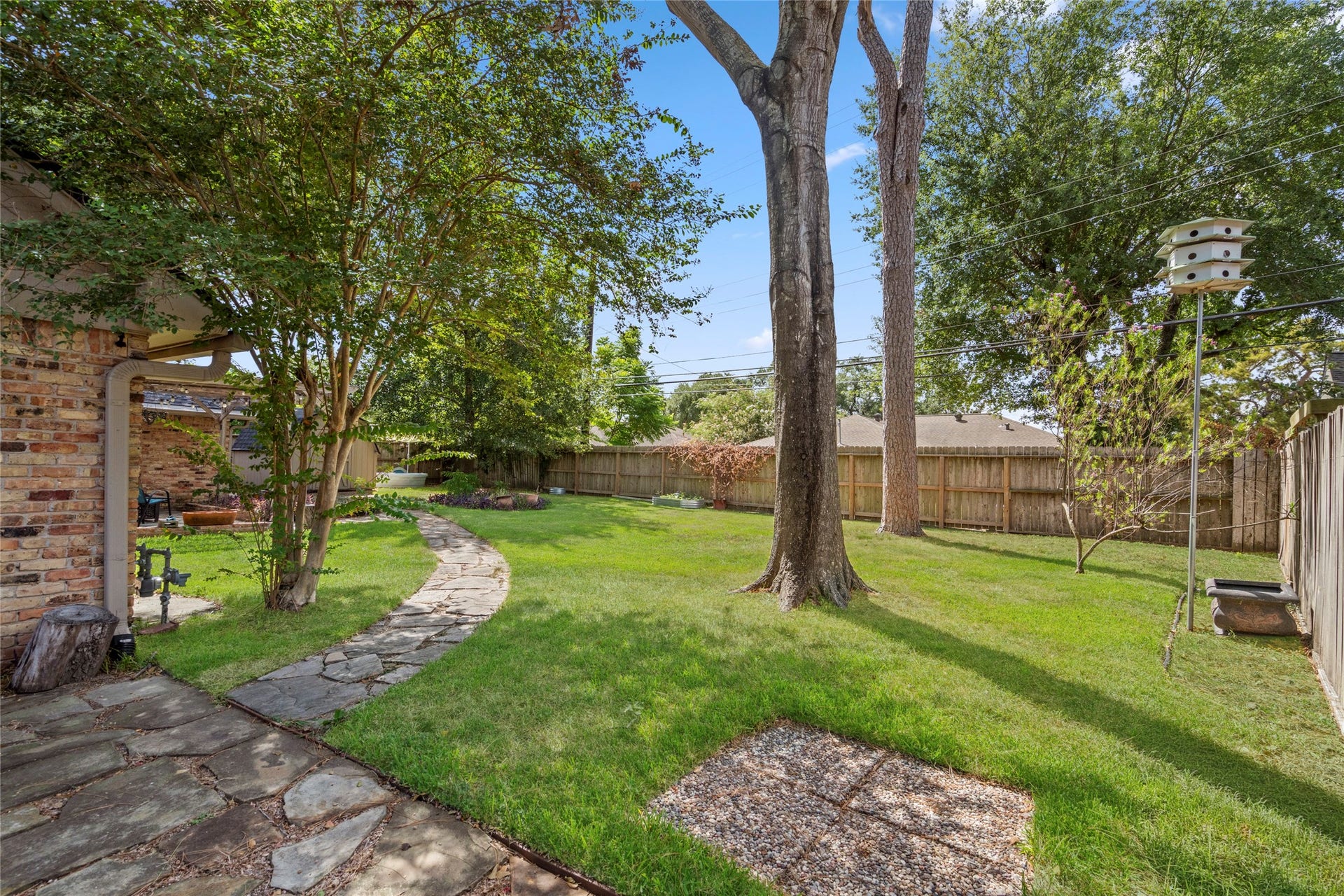 10519 Londonderry Drive, Houston, TX 77043 Well curated landscaping shines through every inch of this yard
