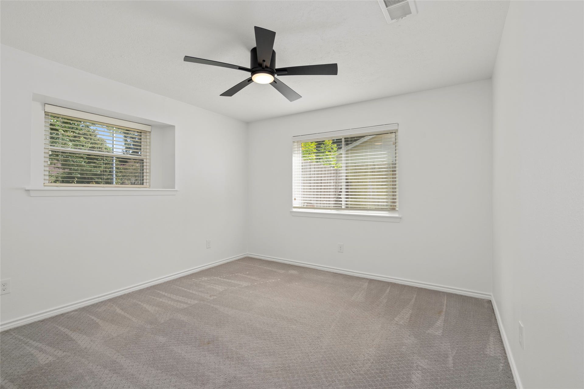 10519 Londonderry Drive, Houston, TX 77043 First of two secondary bedrooms with plush carpeting