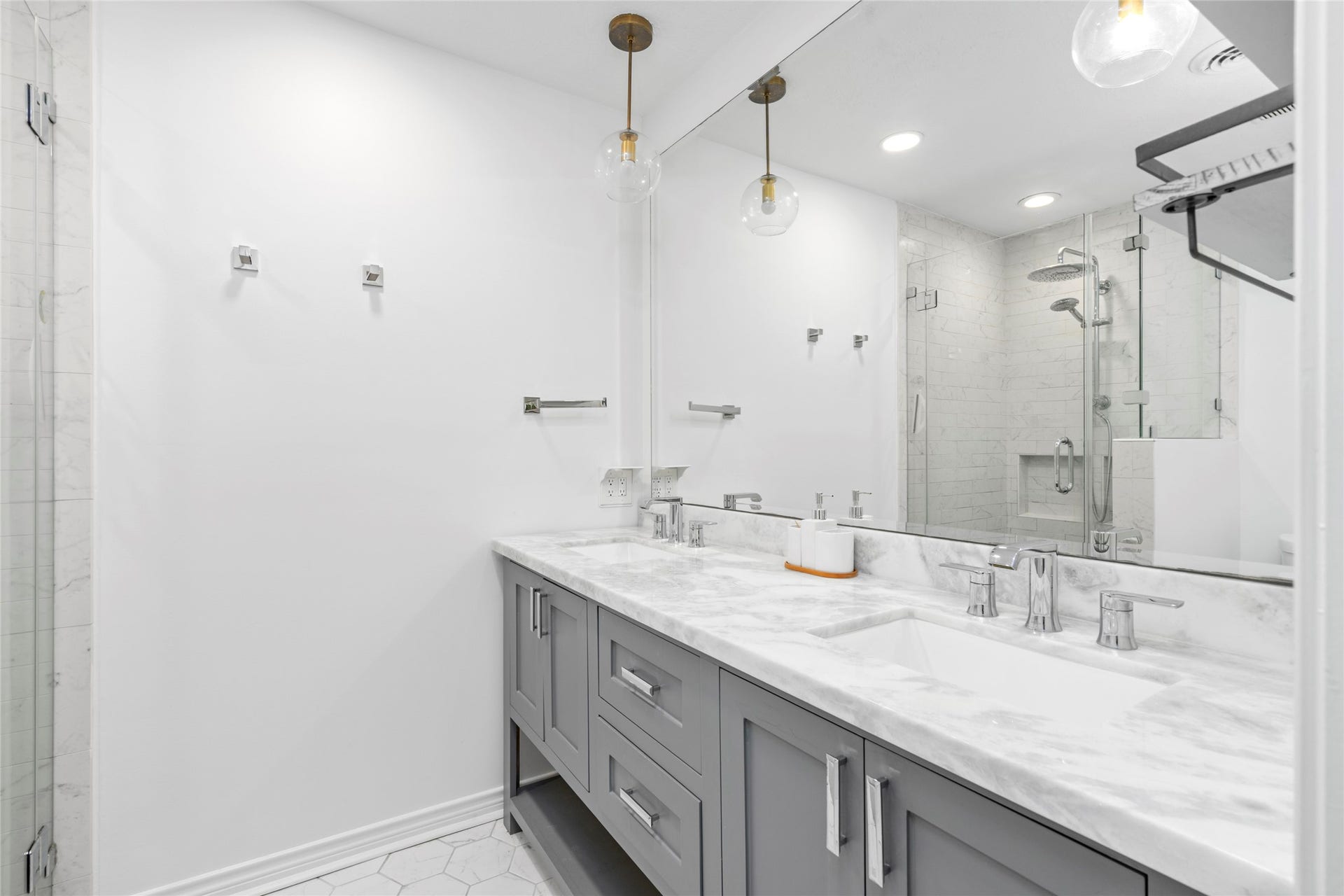 10519 Londonderry Drive, Houston, TX 77043 Primary ensuite includes updated fixtures, plenty of cabinets, and double sinks