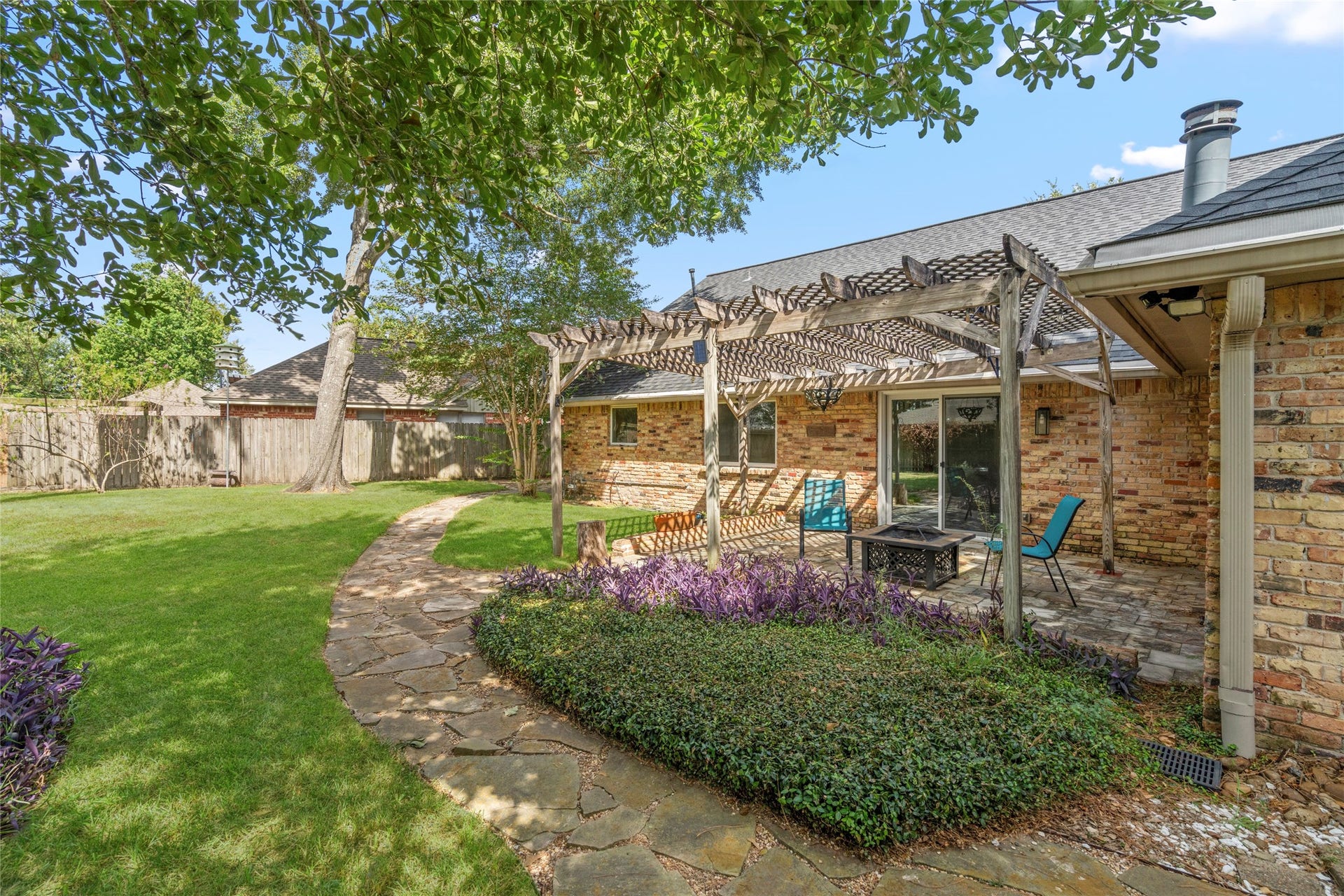 10519 Londonderry Drive, Houston, TX 77043 Mature landscaping, upgraded drainage, and thoughtful grading frame the exterior of the home