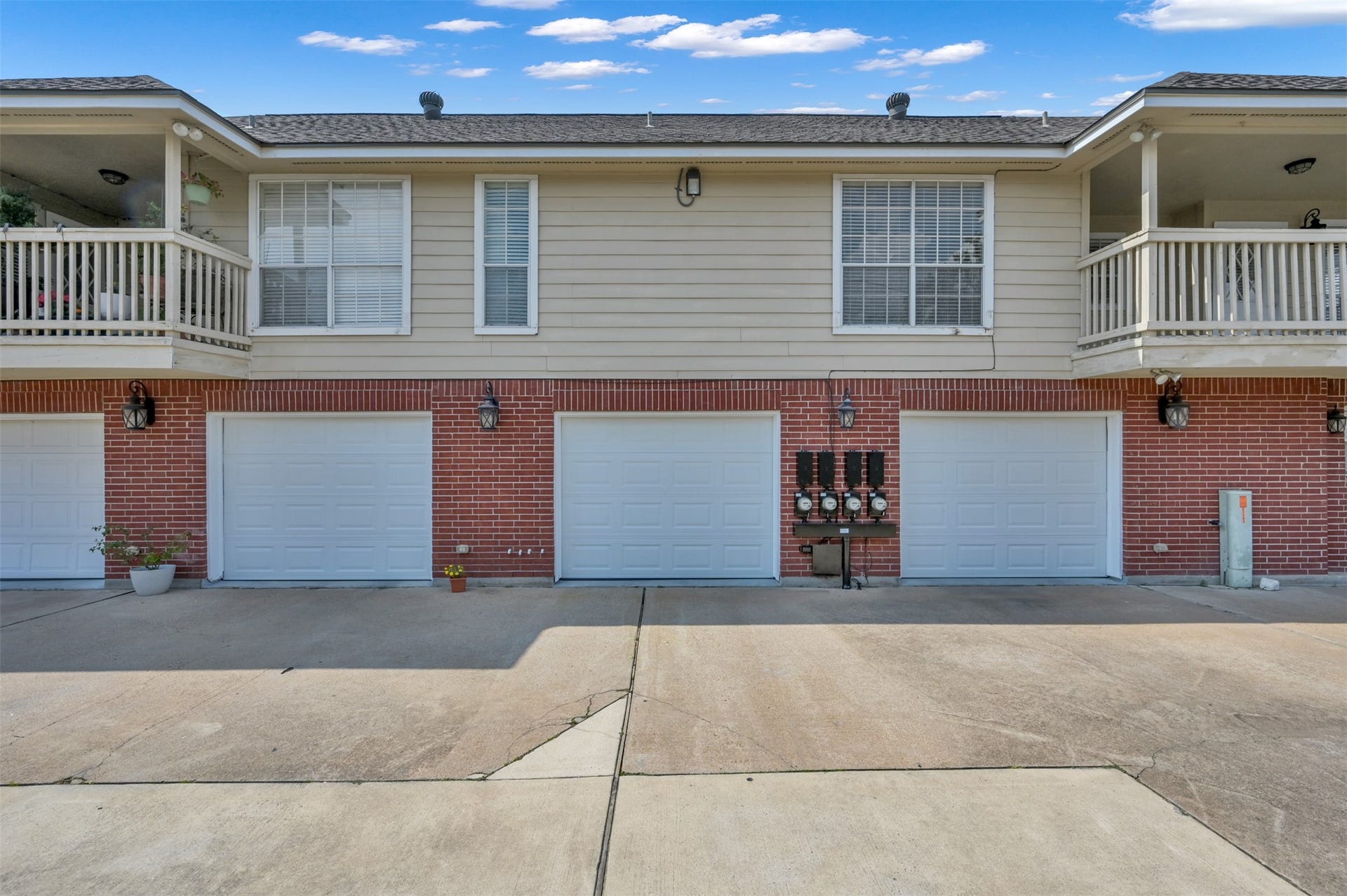 1141 Lovett Street, Tomball, TX 77375 One of 4, this charming unit has 1 car garage with direct entry into kitchen and a private balcony, exterior accented by classic brickwork and elegant exterior lighting.