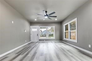 Light filled open living space with wide plank floors, new windows, and a layout made for relaxing and entertaining.