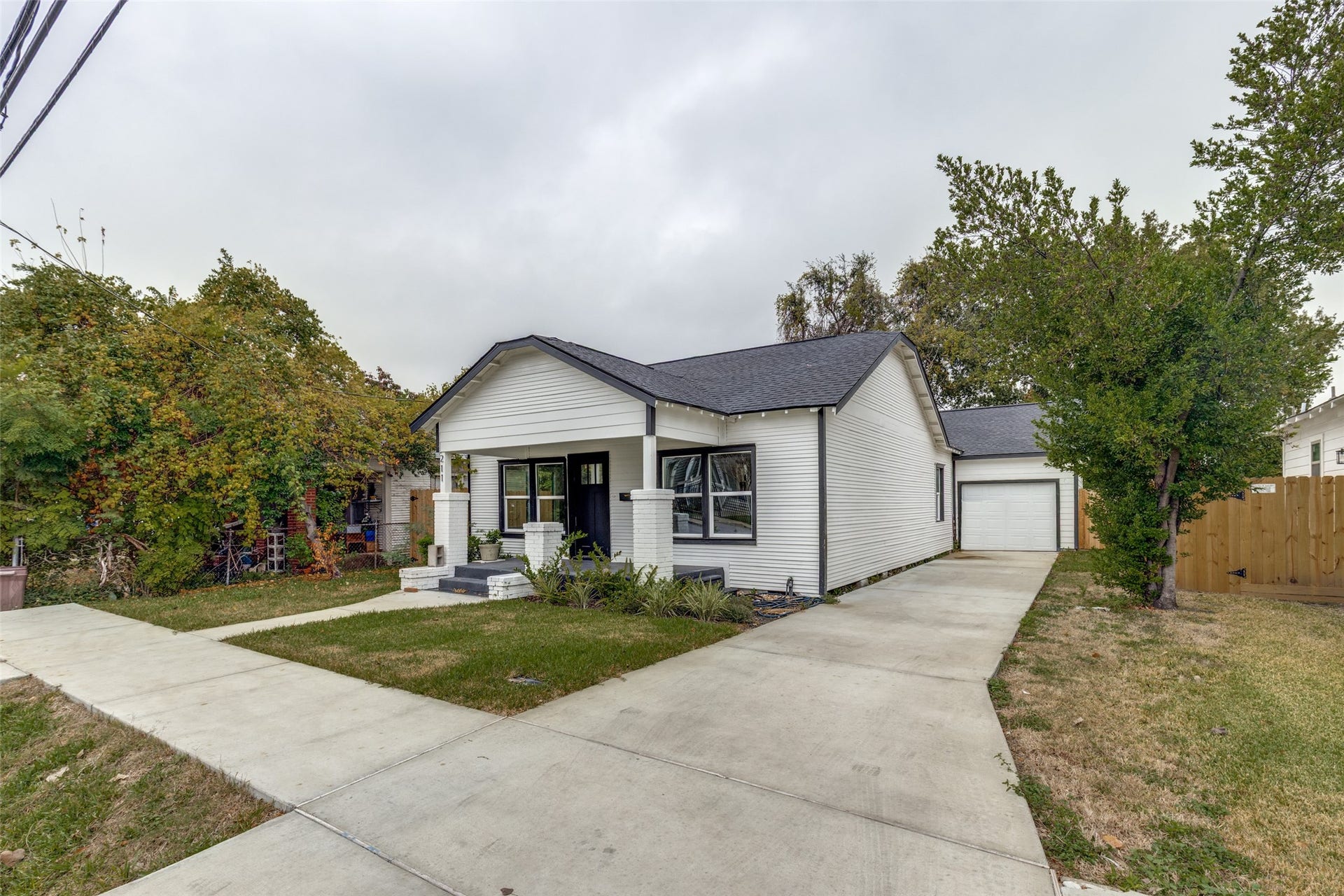 Rare for the neighborhood: a private driveway plus a private one car garage, real everyday convenience in the city.