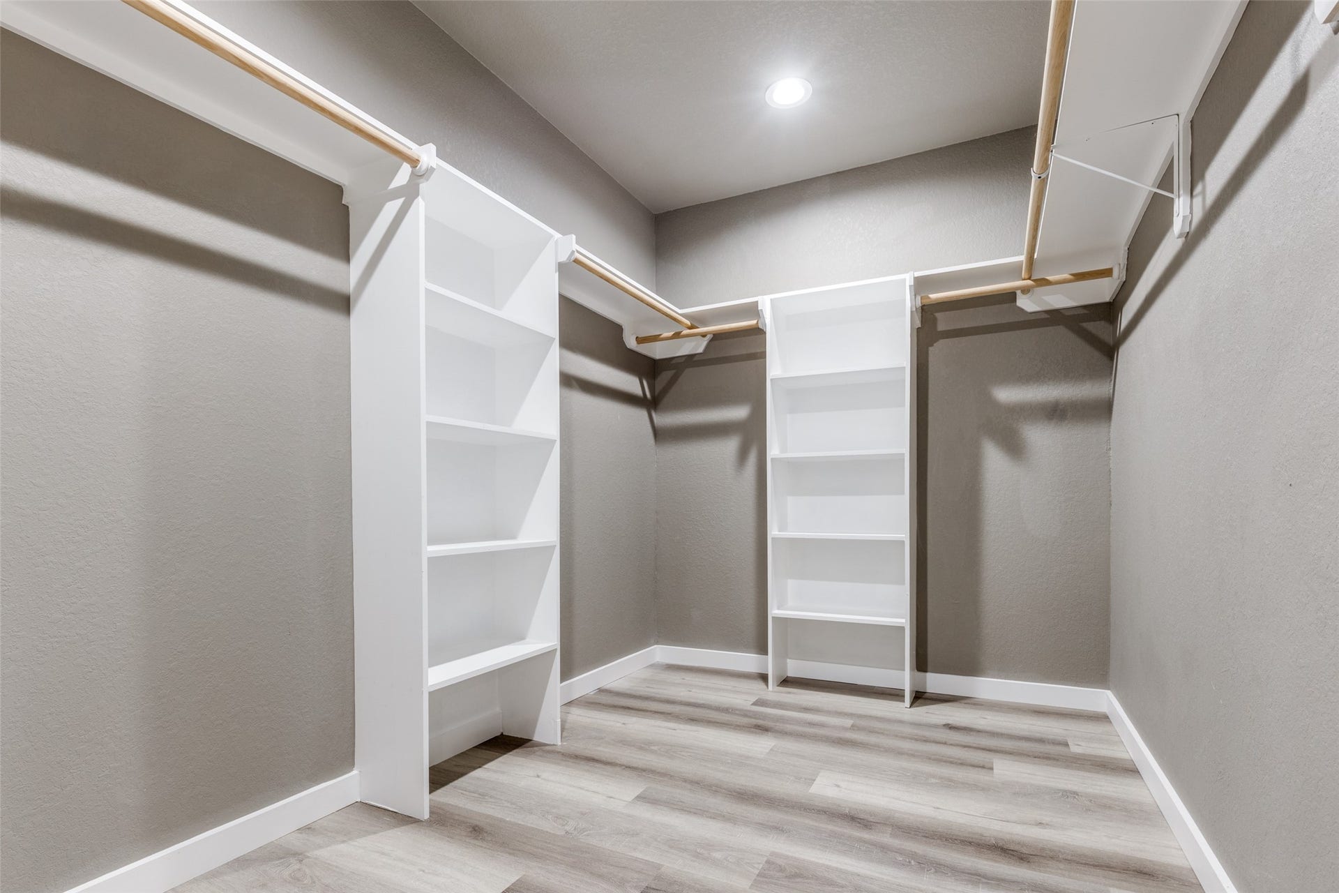 Walk in closet with built in shelving and storage, a rare upgrade that makes daily life feel easy.