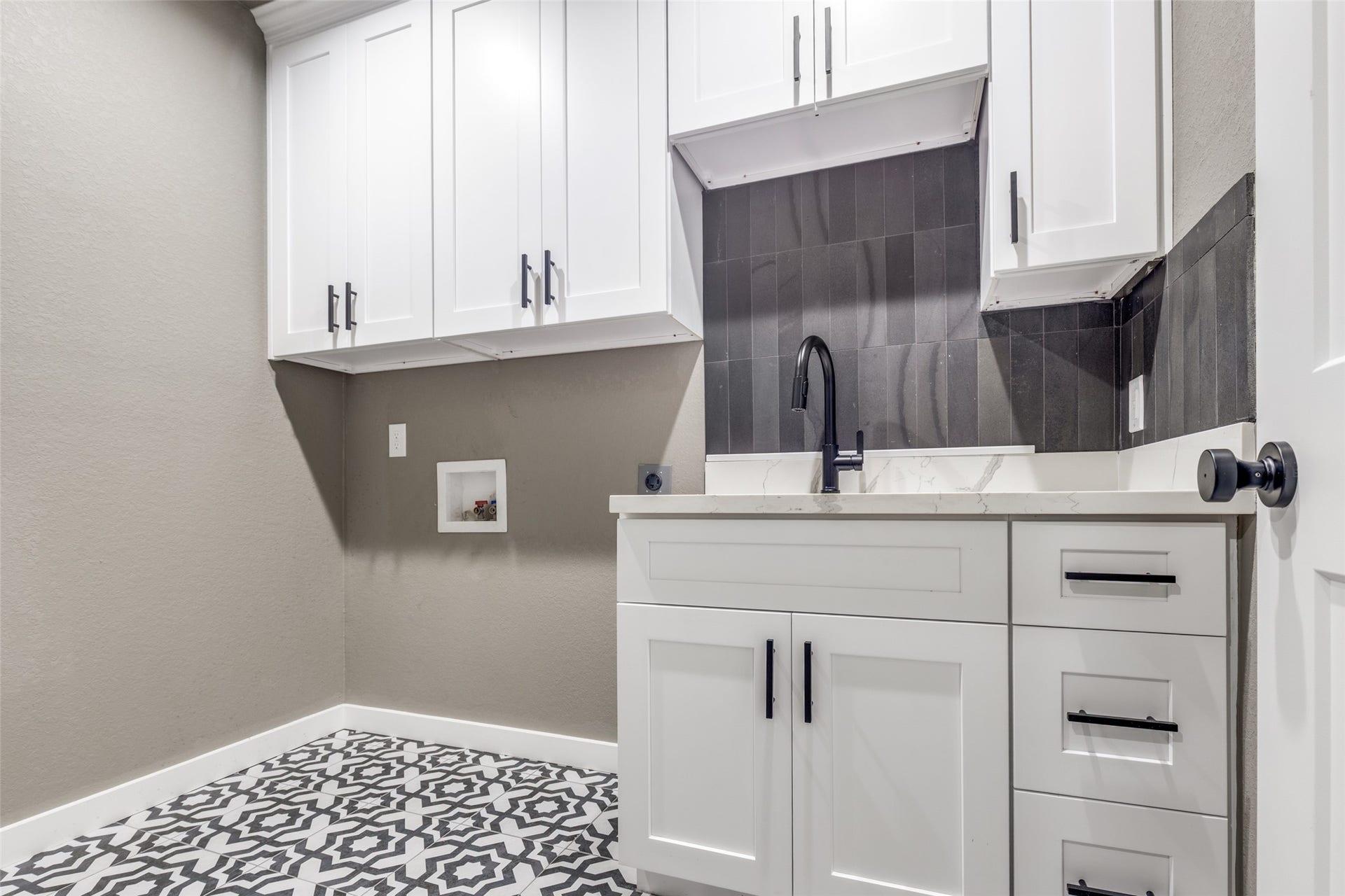 Smart utility and laundry space with extra cabinetry and counter room, perfect for staying organized and keeping clutter out of sight.