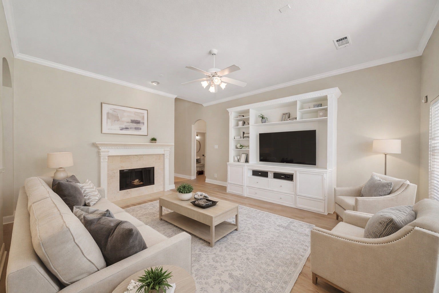 3907 Garnet Falls, Sugar Land, TX 77479 *Virtually staged* Living room featuring a cozy fireplace and built-in shelving.