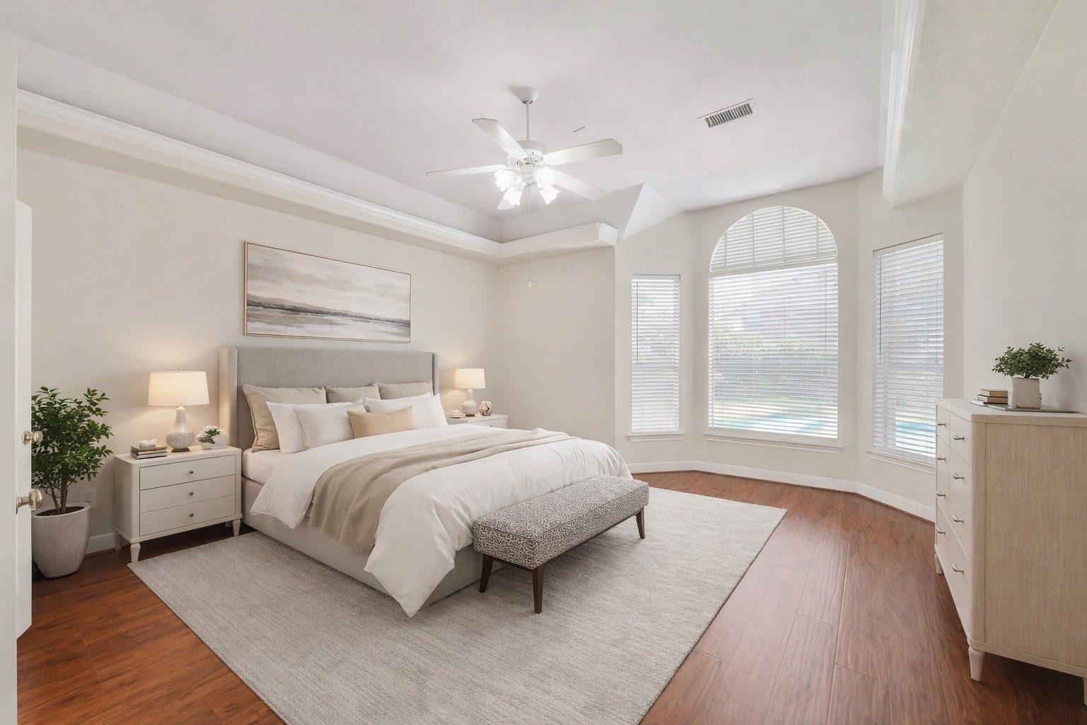 3907 Garnet Falls, Sugar Land, TX 77479 *Virtually staged* The primary bedroom features elegant hardwood floors and a large bay window facing the private pool.