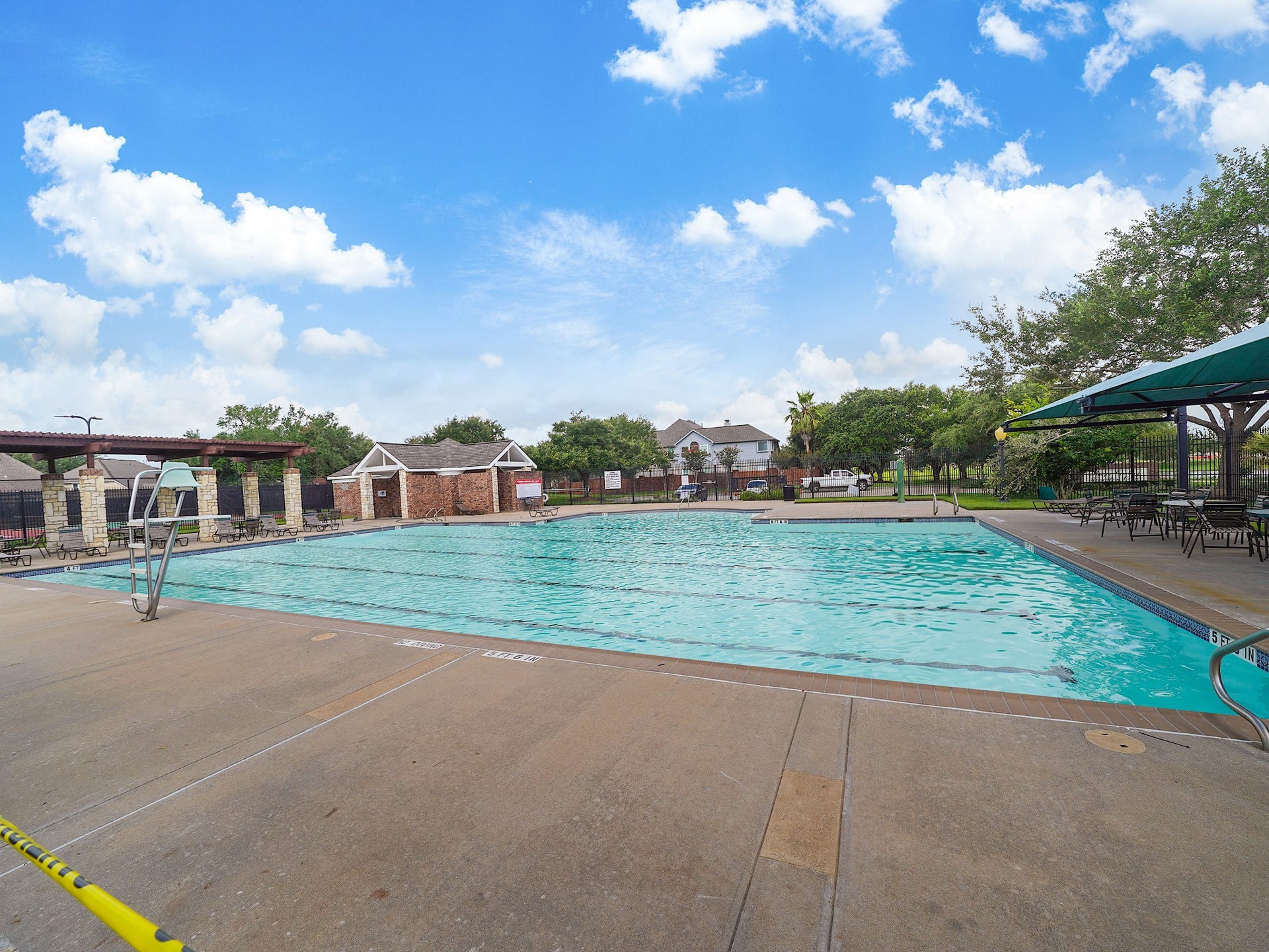 3907 Garnet Falls, Sugar Land, TX 77479 Community area featuring picnic tables, tennis court, pool, and a playground.