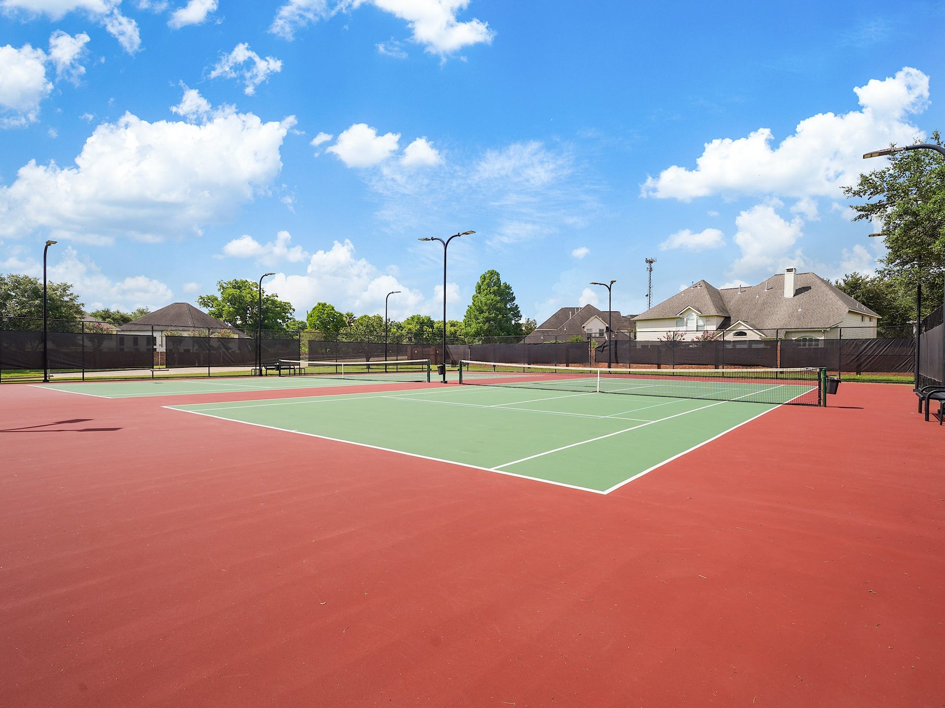 3907 Garnet Falls, Sugar Land, TX 77479 Community area featuring picnic tables, tennis court, pool, and a playground.