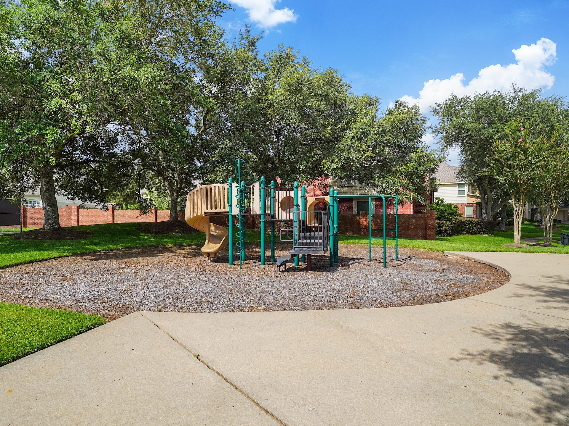 3907 Garnet Falls, Sugar Land, TX 77479 Community area featuring picnic tables, tennis court, pool, and a playground.