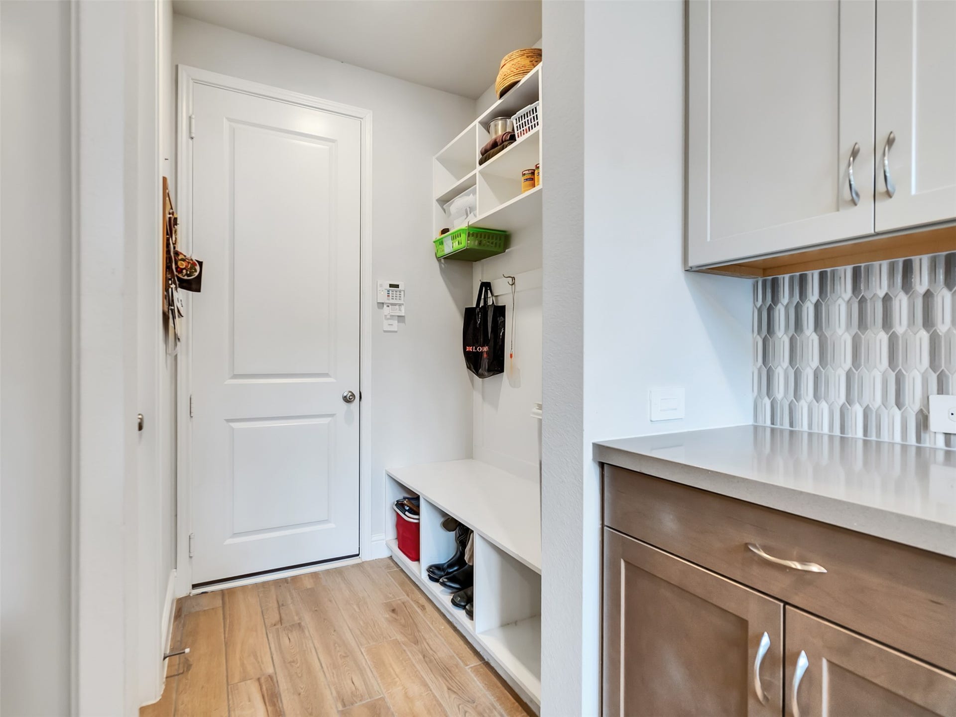 17204 Begonia Bend Drive, Conroe, TX 77302 Mud-room with custom-built shelves