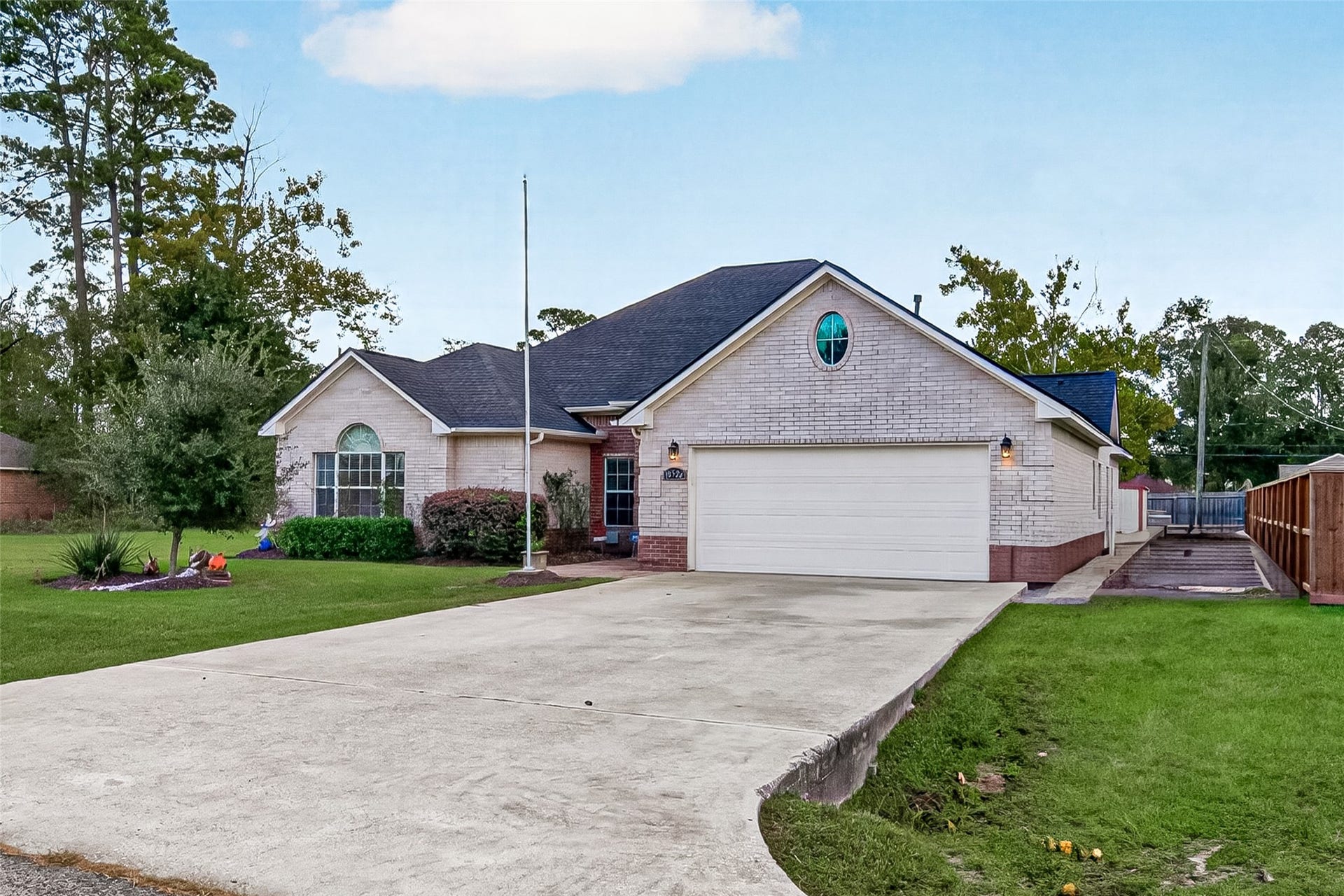 Attached two-car garage with a spacious driveway for additional parking