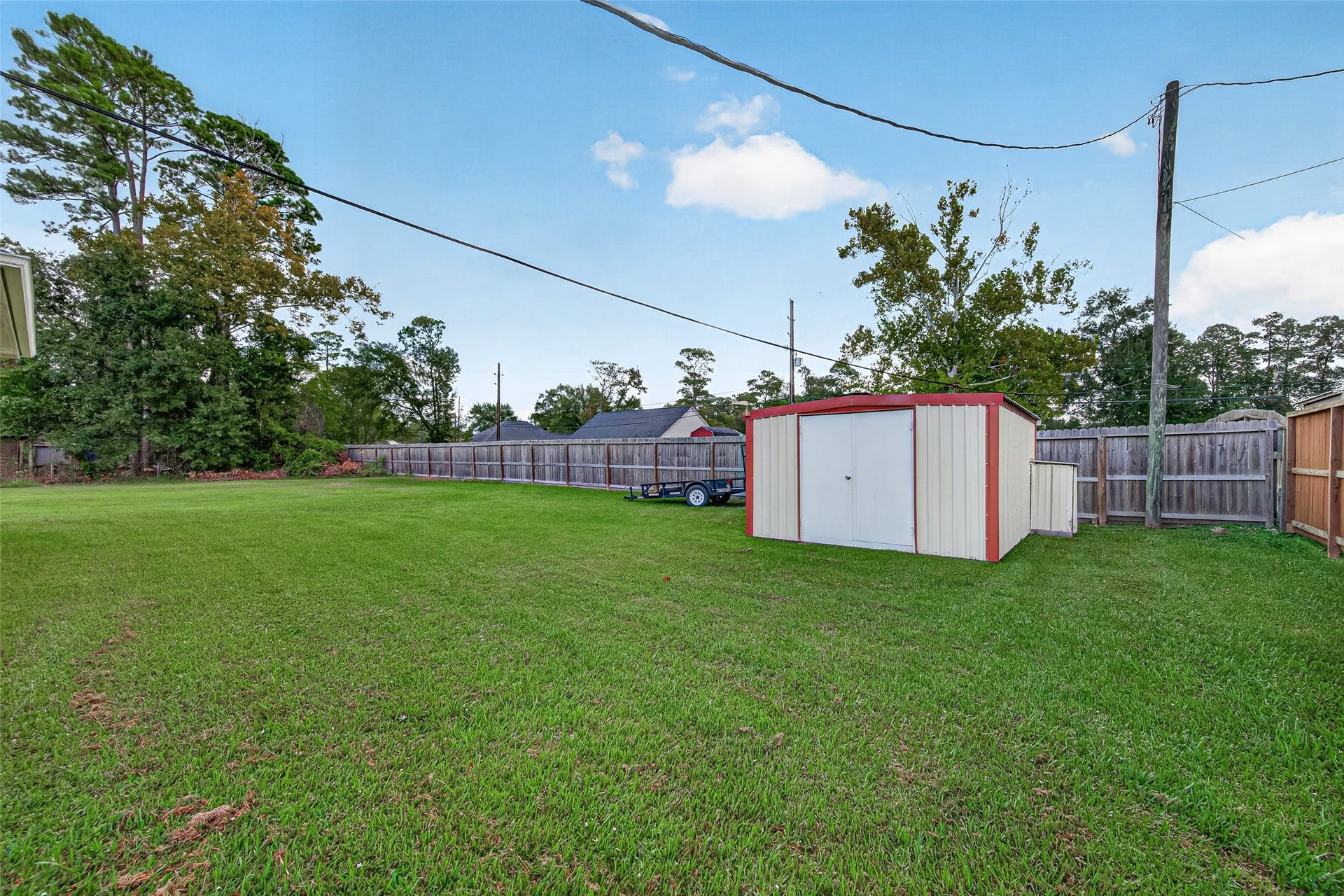 Enjoy the convenience of a backyard storage shed while still having plenty of open lawn space for outdoor activities.