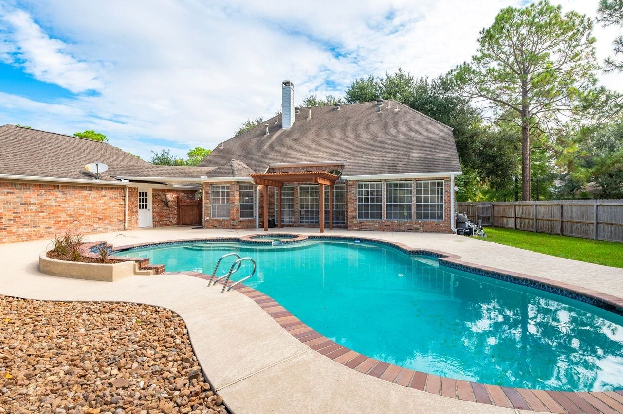 4131 Raven River Drive, Pasadena, TX 77059 Your own backyard retreat! Enjoy the sparkling pool and spa surrounded by expansive cool decking, an oversized lot and plenty of space for relaxing or entertaining. Virtually staged to illustrate the outdoor living potential.