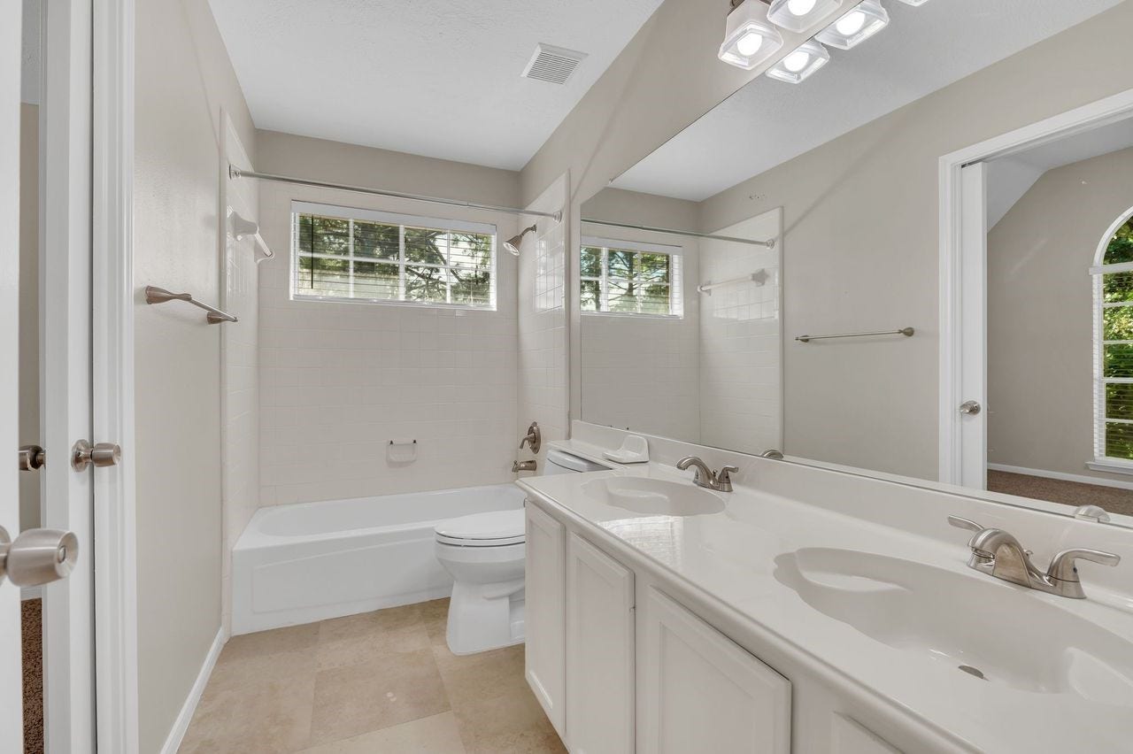 4131 Raven River Drive, Pasadena, TX 77059 Conveniently located upstairs full bath serves the secondary bedrooms and gameroom, offering easy access for family and guests.