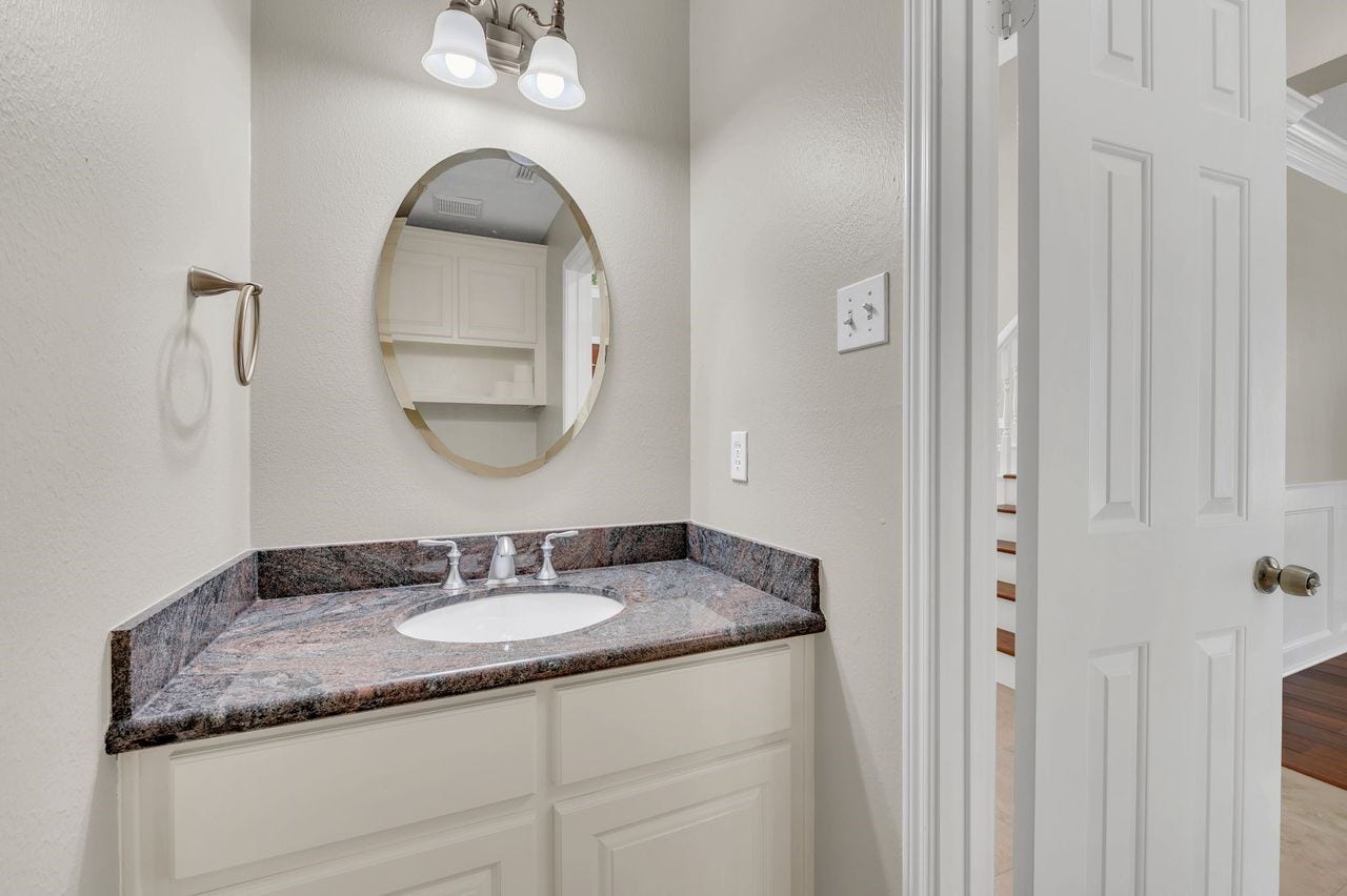 4131 Raven River Drive, Pasadena, TX 77059 Charming guest half bath adds convenience and style to the main level.