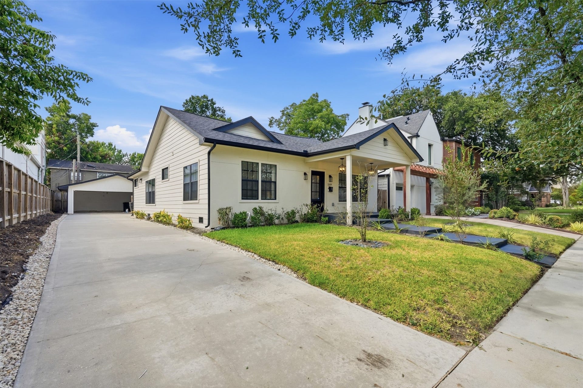 2109 Sul Ross Street, Houston, TX 77098 Charming curb appeal with an extended driveway and welcoming front porch