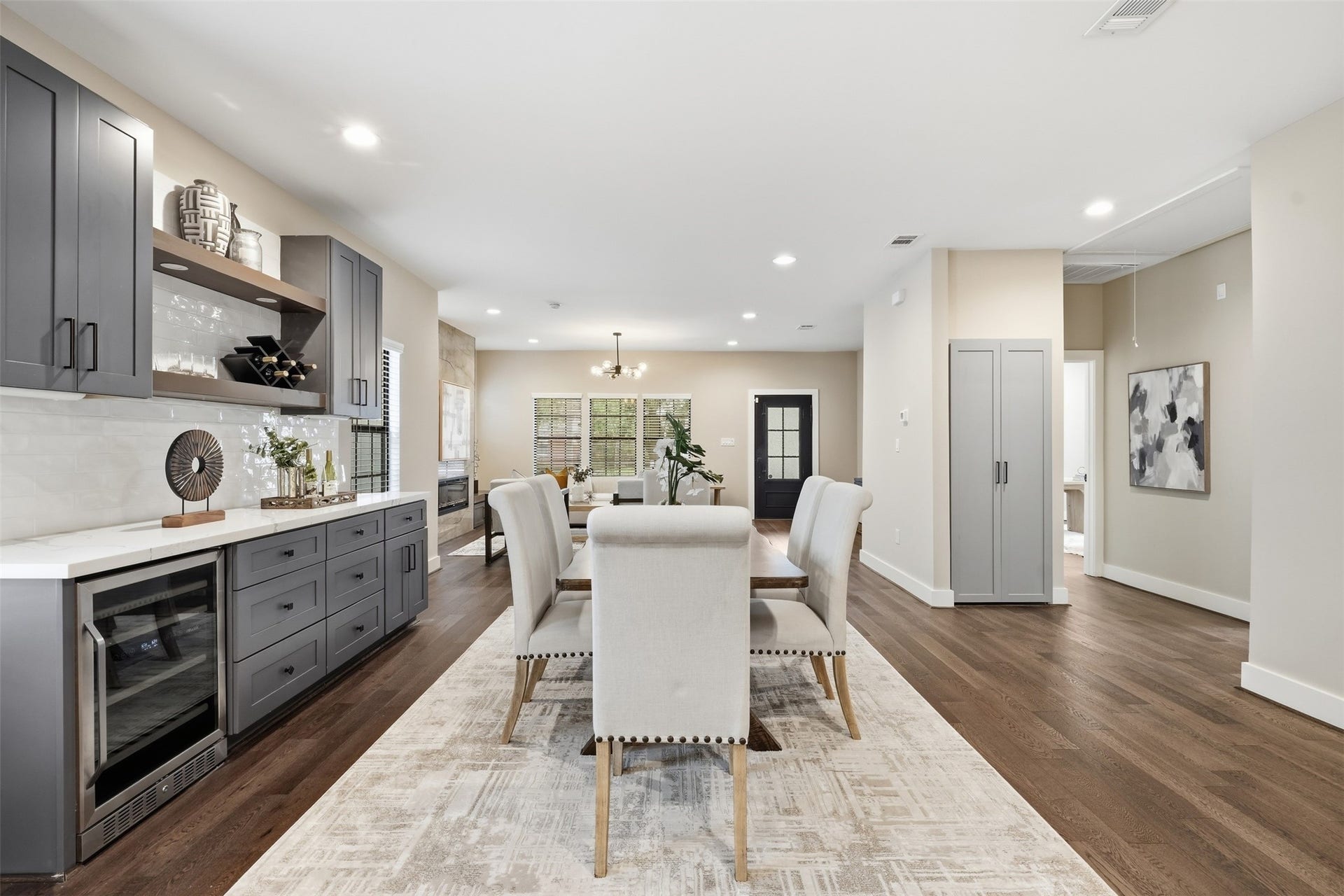 2109 Sul Ross Street, Houston, TX 77098 Stylish dining area with custom cabinetry and a built-in beverage refrigerator