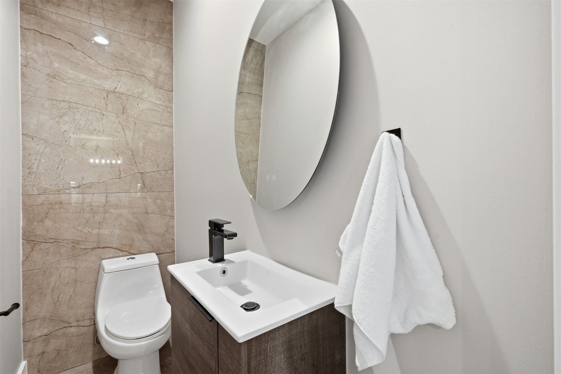2109 Sul Ross Street, Houston, TX 77098 Chic powder room with contemporary fixtures and stylish accent tile.