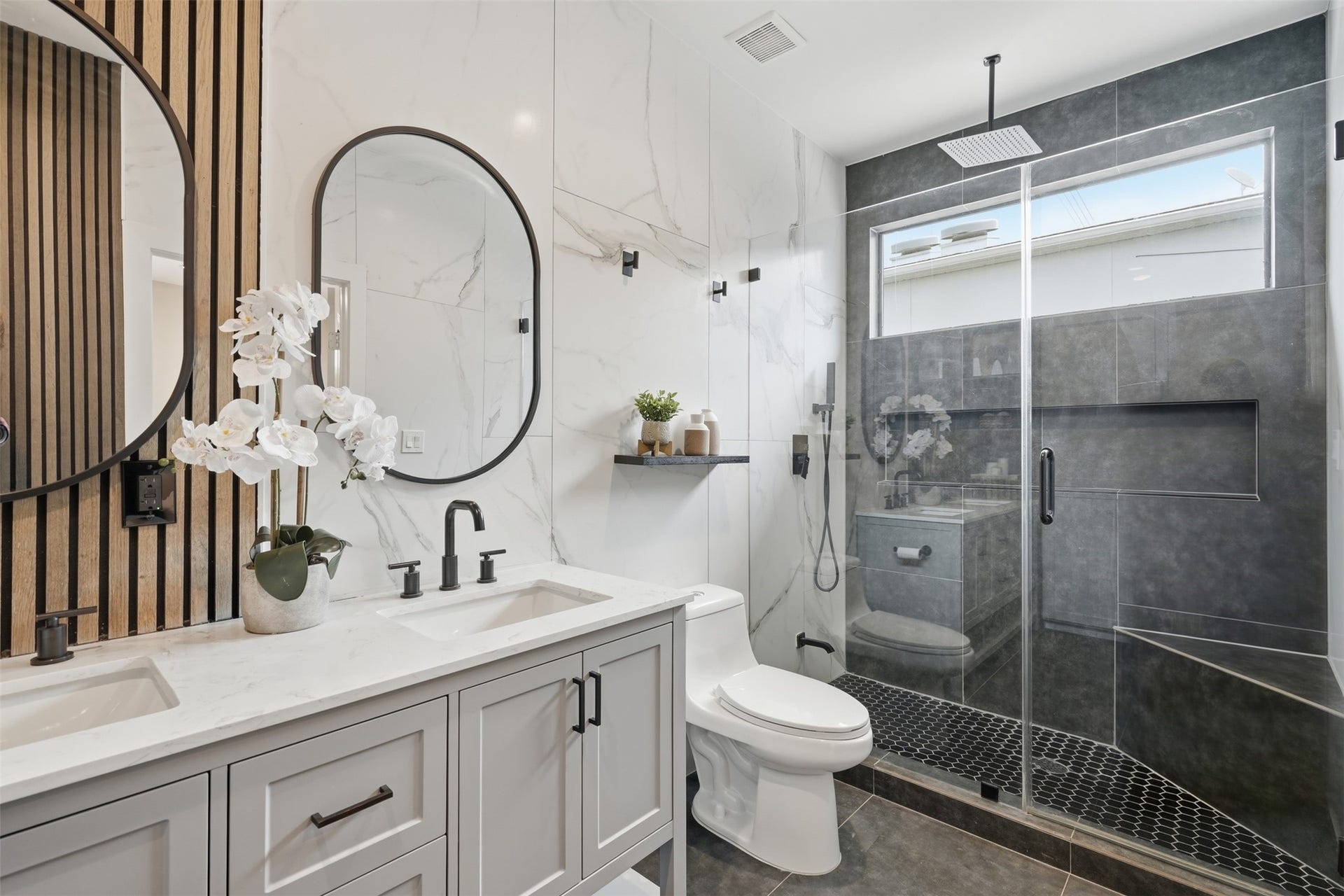 2109 Sul Ross Street, Houston, TX 77098 Spa-inspired bathroom with modern finishes and a spacious glass-enclosed shower
