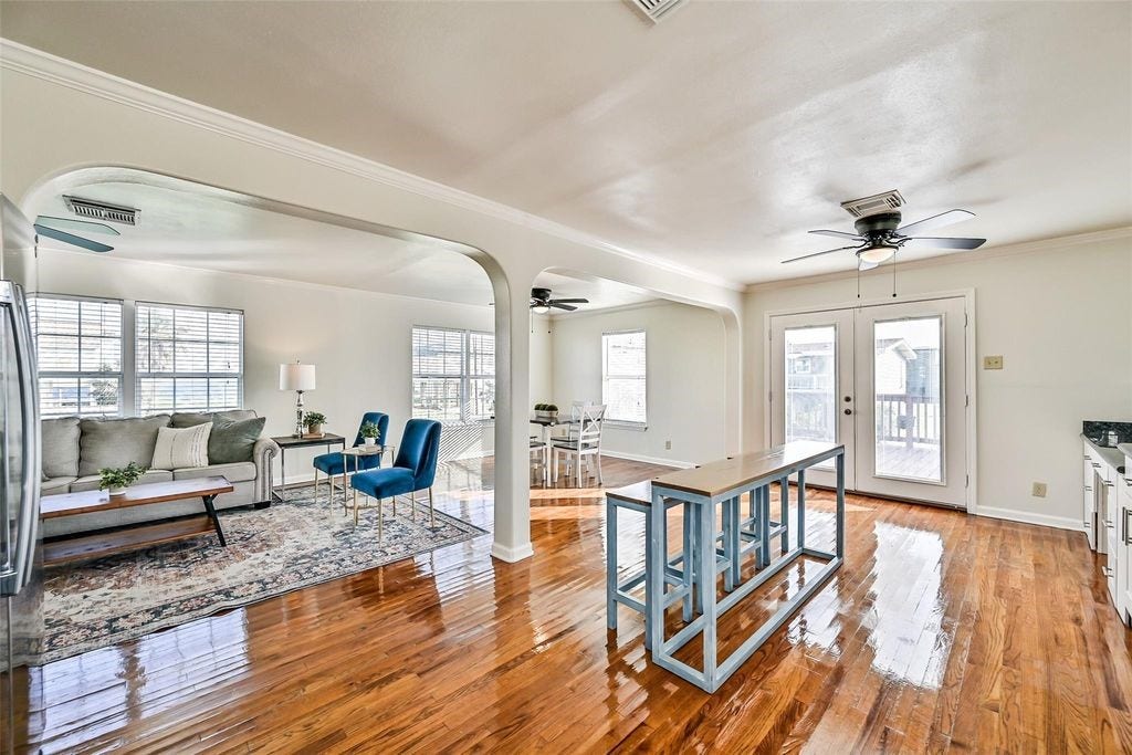 1029 62nd Street, #Up, Galveston, TX 77551 Lots of windows allowing the sun to reach every corner of this unit. Also, dual working patio doors allowing the breeze in on those Fall evenings.