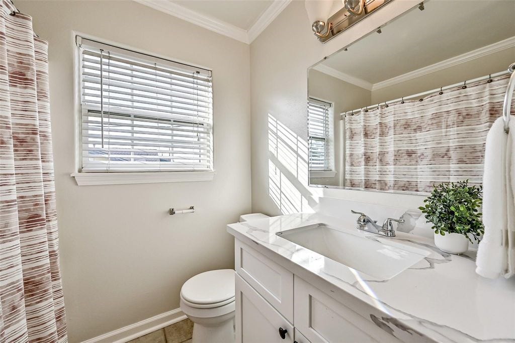 1029 62nd Street, #Up, Galveston, TX 77551 Updated quartz countertop and vanity.