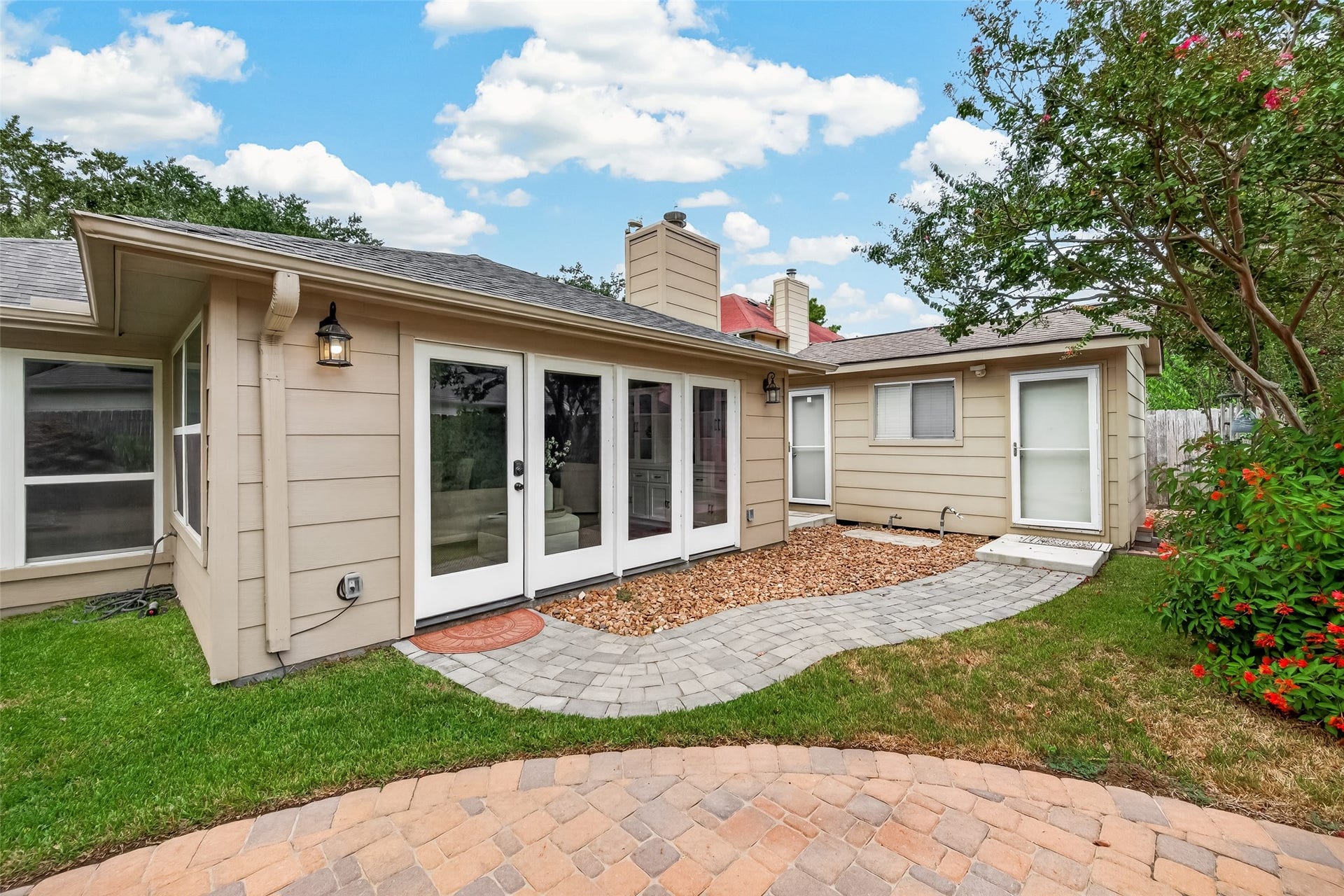 1518 Watts Avenue, Katy, TX 77493 In the backyard, there is a small house built to the left as you exit the back door. The house is divided and one side is storage and the other can be anything you like. It was used for a workshop and an extra bedroom.
