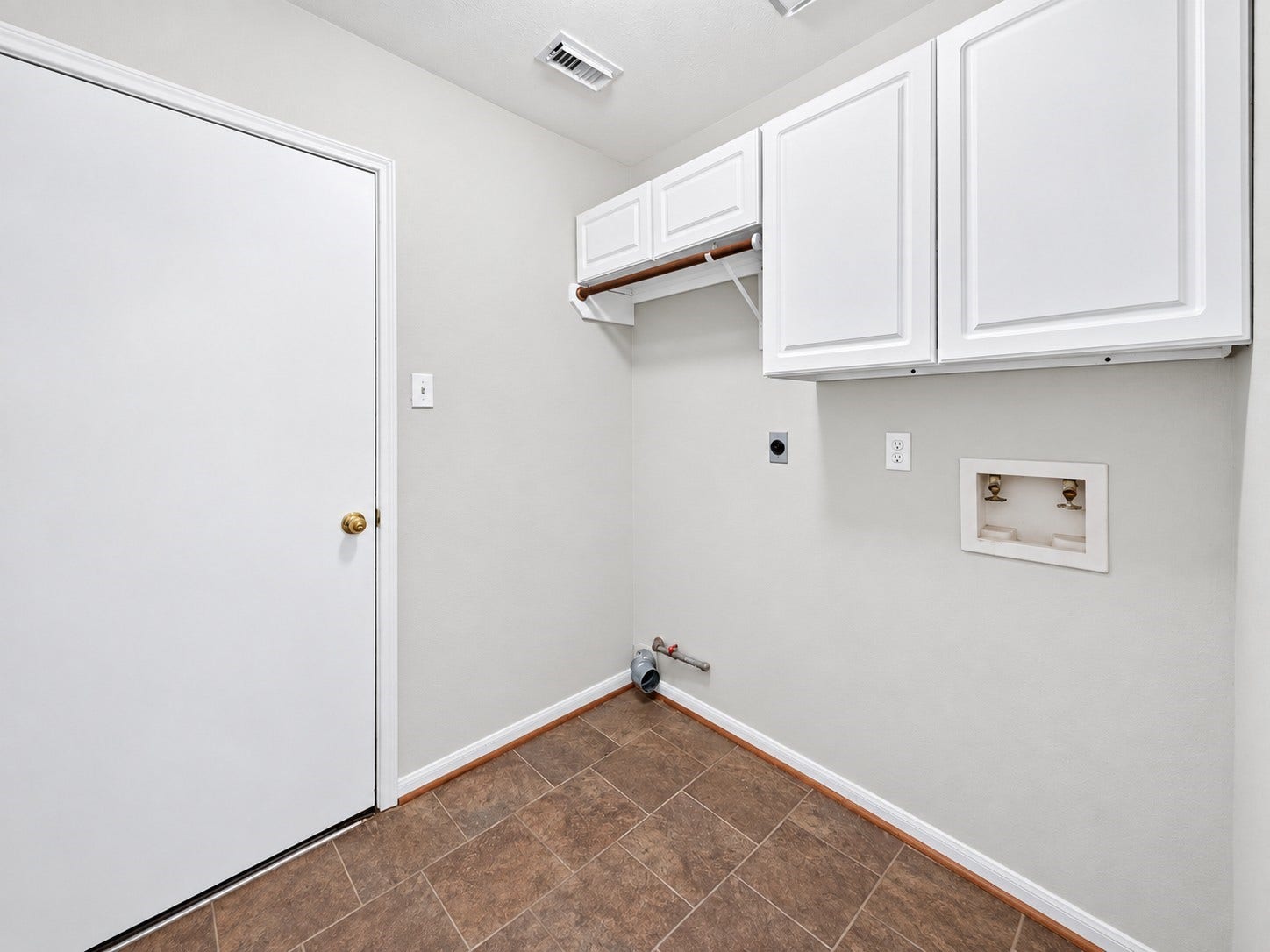 1518 Watts Avenue, Katy, TX 77493 The utility room has shelving for all your washing and drying needs.