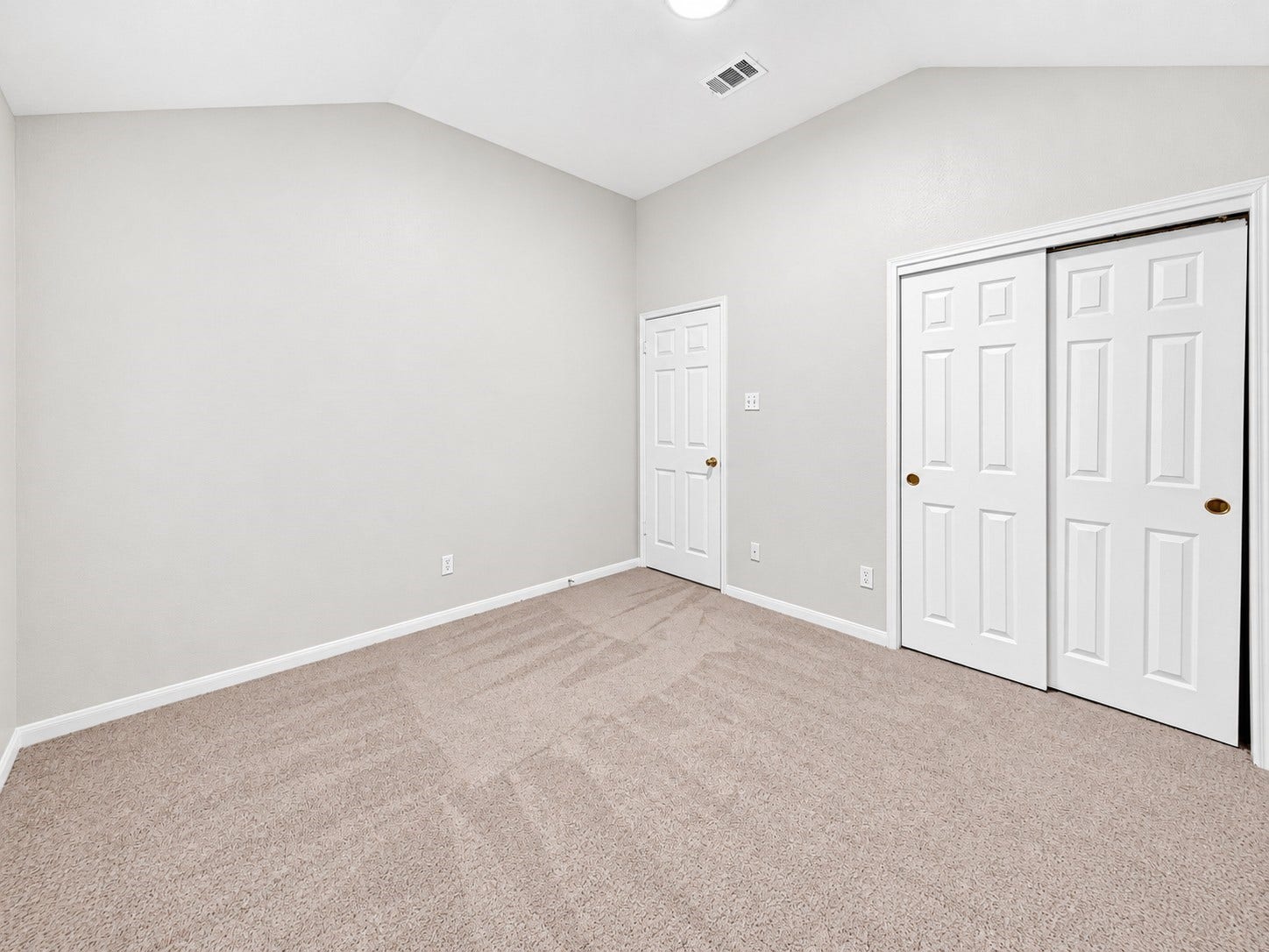 1518 Watts Avenue, Katy, TX 77493 The view from the window into the secondary bedroom. Both bedrooms feature fresh paint, updated lighting and new carpet.