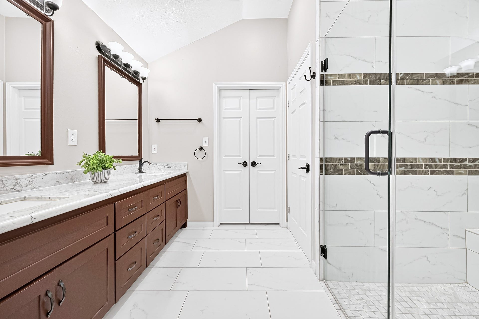 1518 Watts Avenue, Katy, TX 77493 The bathroom features marble flooring, updated mirrors & lighting and rich cabinets.