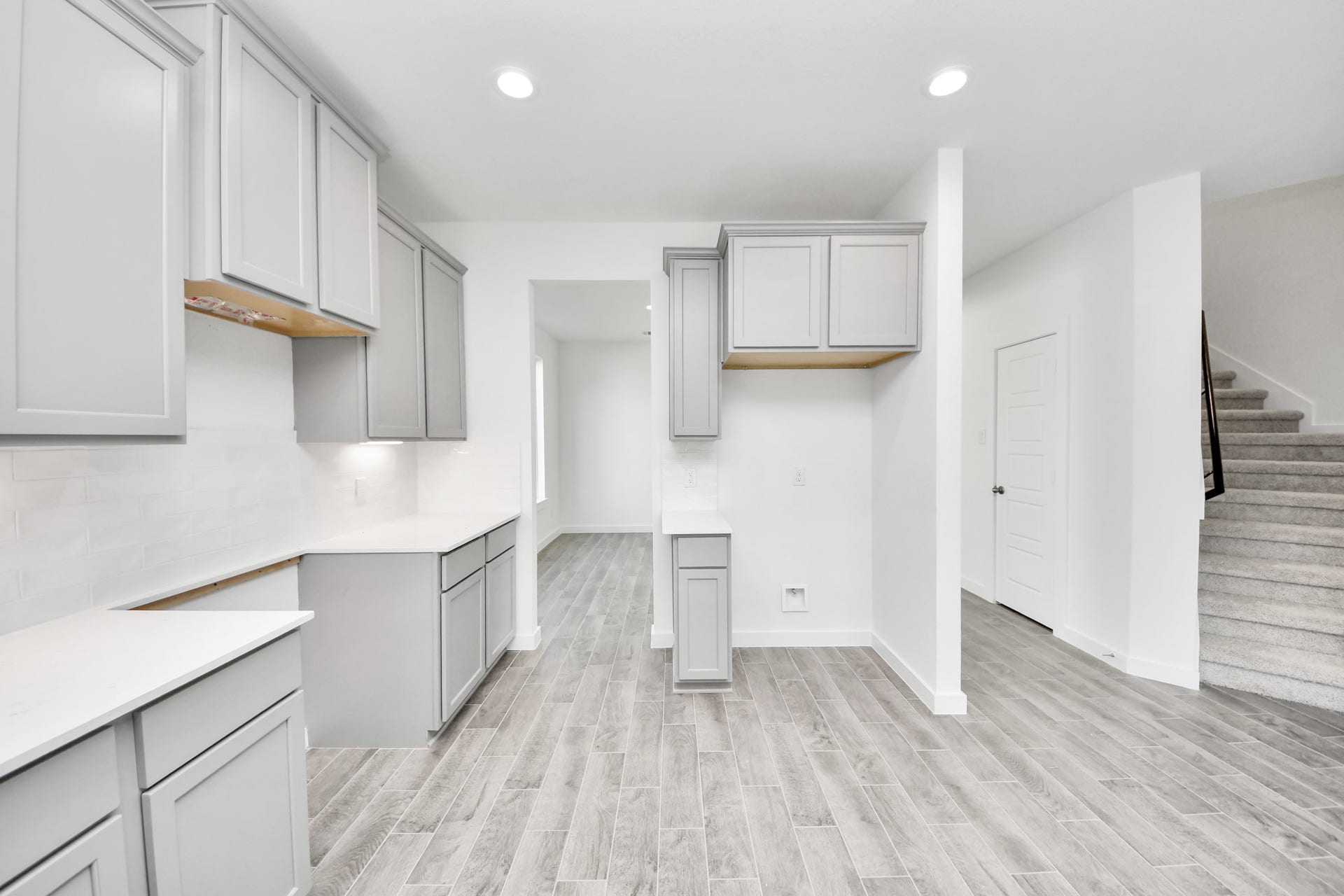 3057 Spoolwood Trail, Magnolia, TX 77355 The open concept effortlessly connects the kitchen to the expansive family room, forming a perfect hub for gatherings. This seamless flow creates an inviting space where cooking and socializing come together harmoniously.