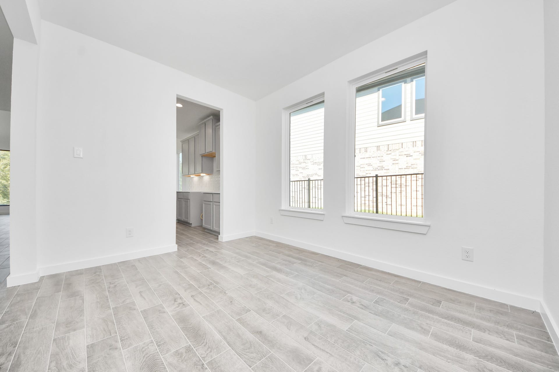 3057 Spoolwood Trail, Magnolia, TX 77355 Make memories gathered around the table with your family and friends! This spacious dining room features elegant flooring, custom paint, and adjacent to family room and kitchen for open concept feel.