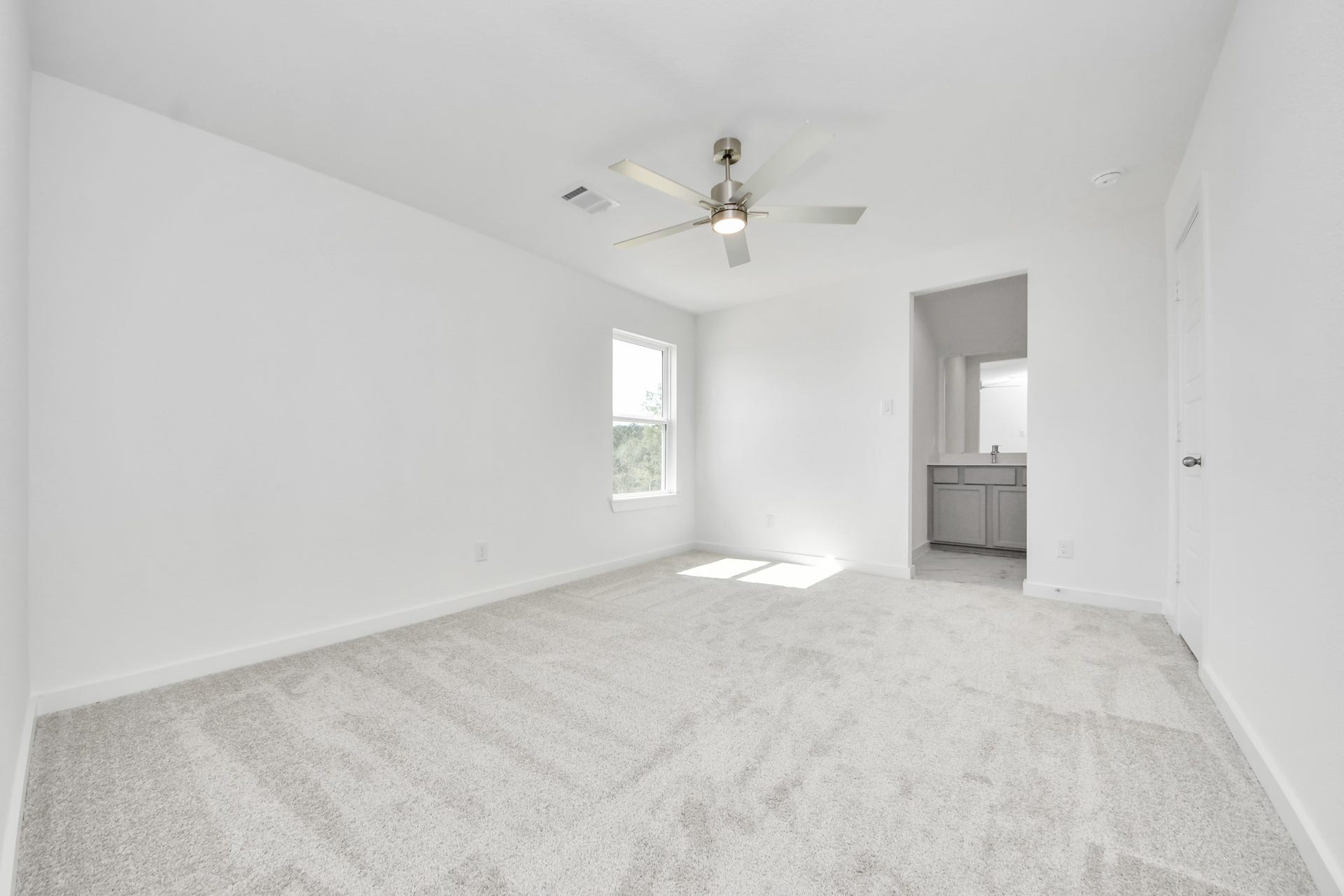 3057 Spoolwood Trail, Magnolia, TX 77355 Generously sized secondary bedrooms featuring spacious closets, soft and inviting carpeting underfoot, large windows allowing plenty of natural light, and the added touch of privacy blinds for your personal retreat.