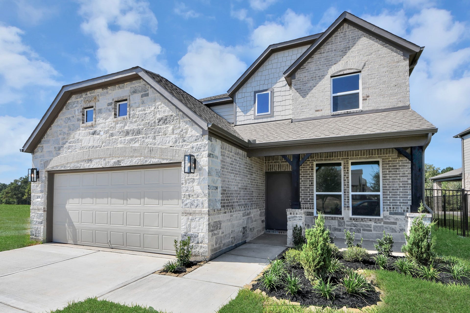 3057 Spoolwood Trail, Magnolia, TX 77355 Home features a convenient 2-car garage complemented by a spacious driveway, offering ample parking for you and your guests.