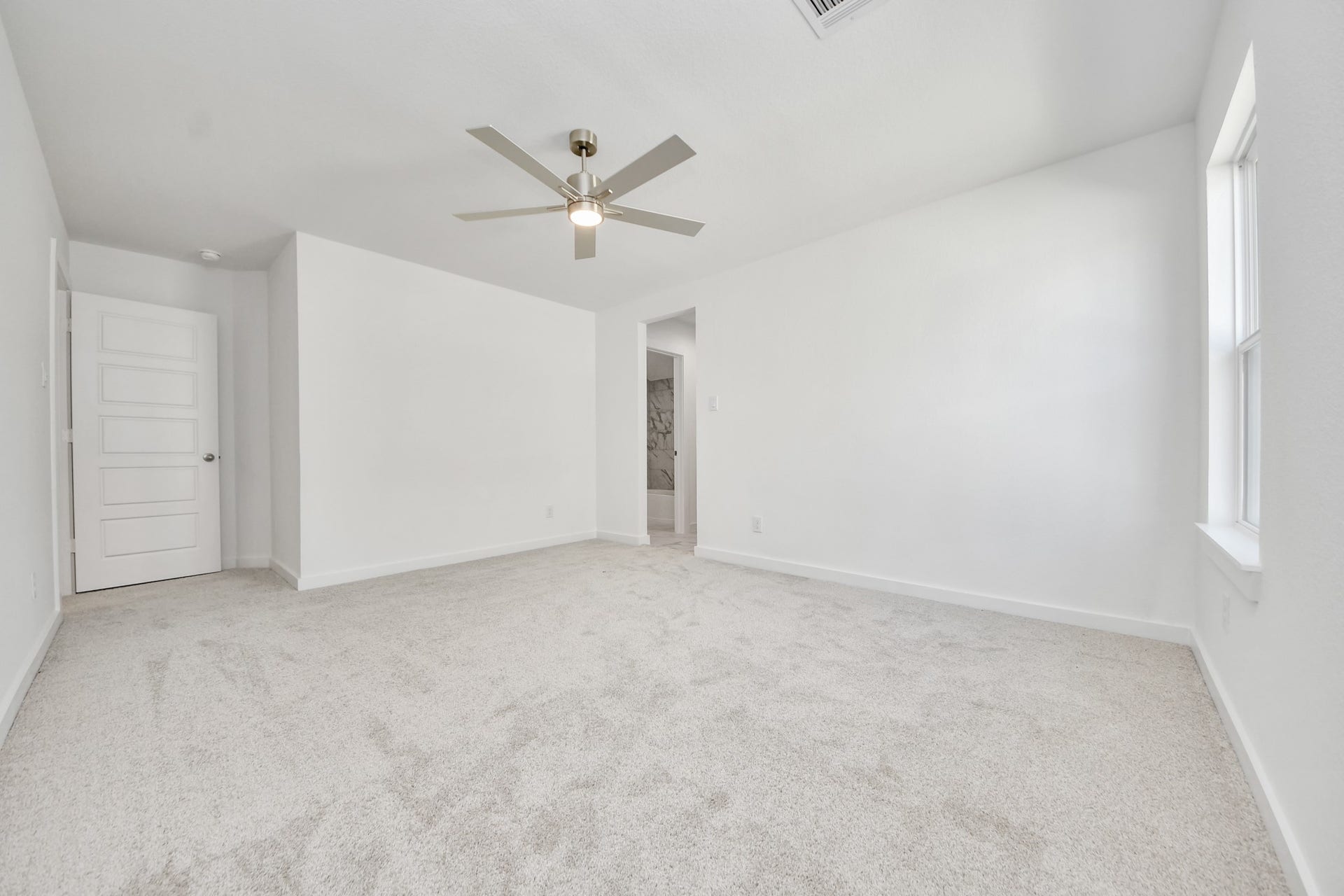 3057 Spoolwood Trail, Magnolia, TX 77355 Generously sized secondary bedrooms featuring spacious closets, soft and inviting carpeting underfoot, large windows allowing plenty of natural light, and the added touch of privacy blinds for your personal retreat.