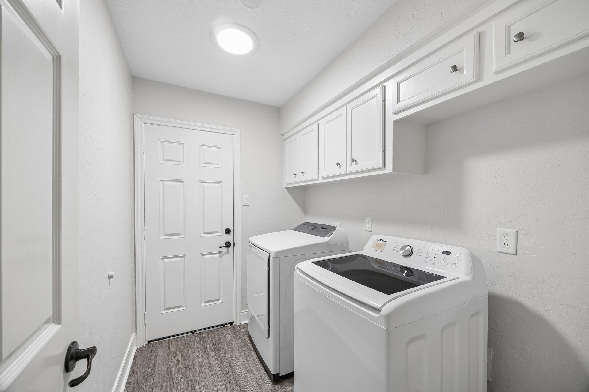 Utility room off with access to 2-car garage. Washer and dryer to stay.