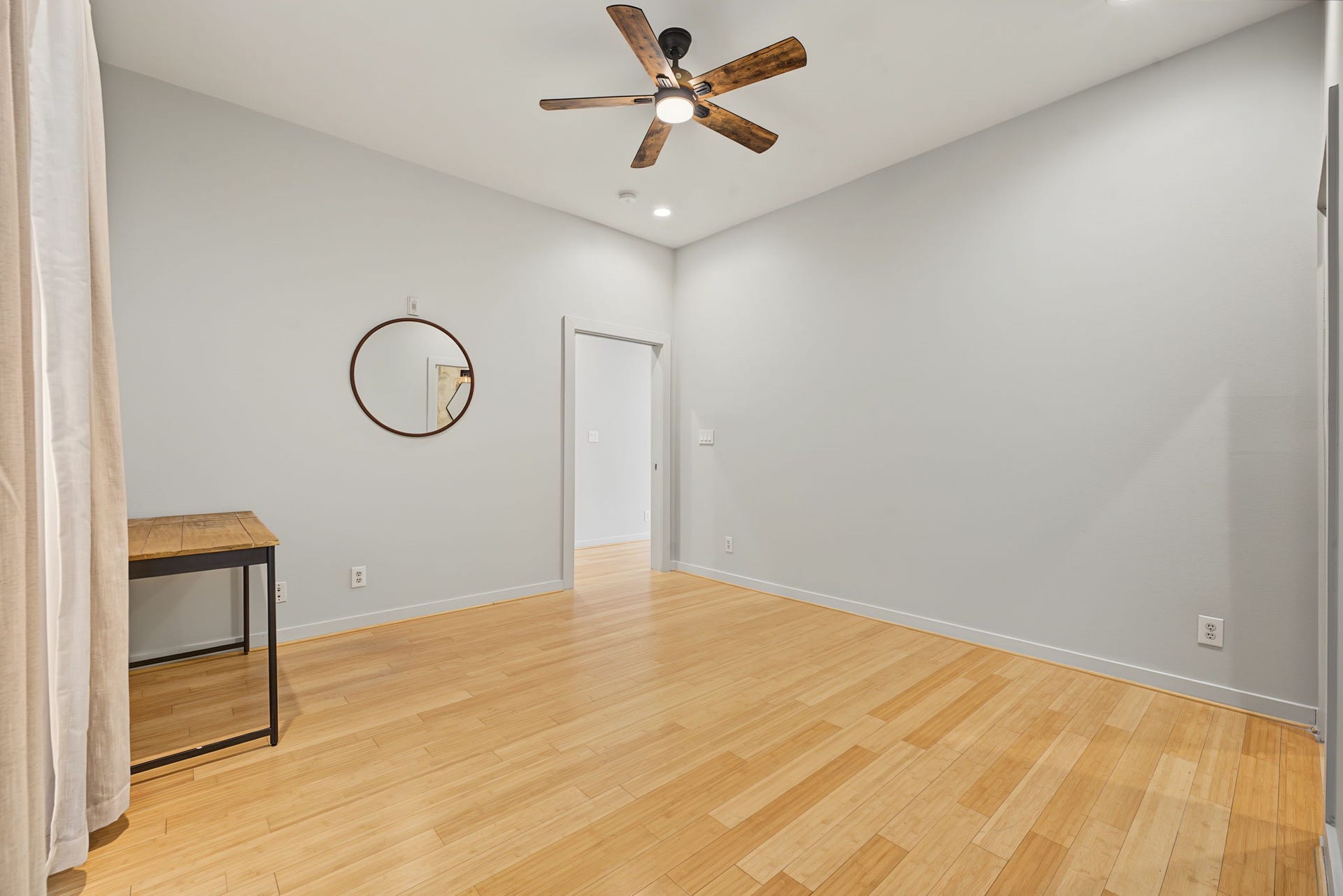 Sleek recessed lighting and a lighted ceiling fan add to the contemporary appeal, offering the perfect blend of modern style and everyday comfort.