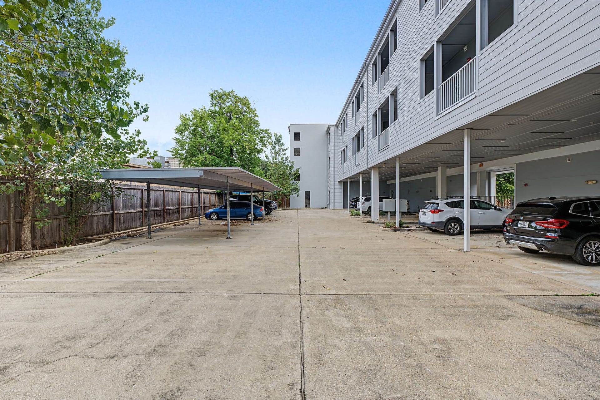 Gated Parking for Added Peace of Mind! Enjoy the convenience of sheltered resident parking within the community's gated rear parking area! Each residence has access to a covered parking space, available on a first-come, first-served basis, offering added protection from the elements and the convenience of secure off-street parking in the heart of the city.