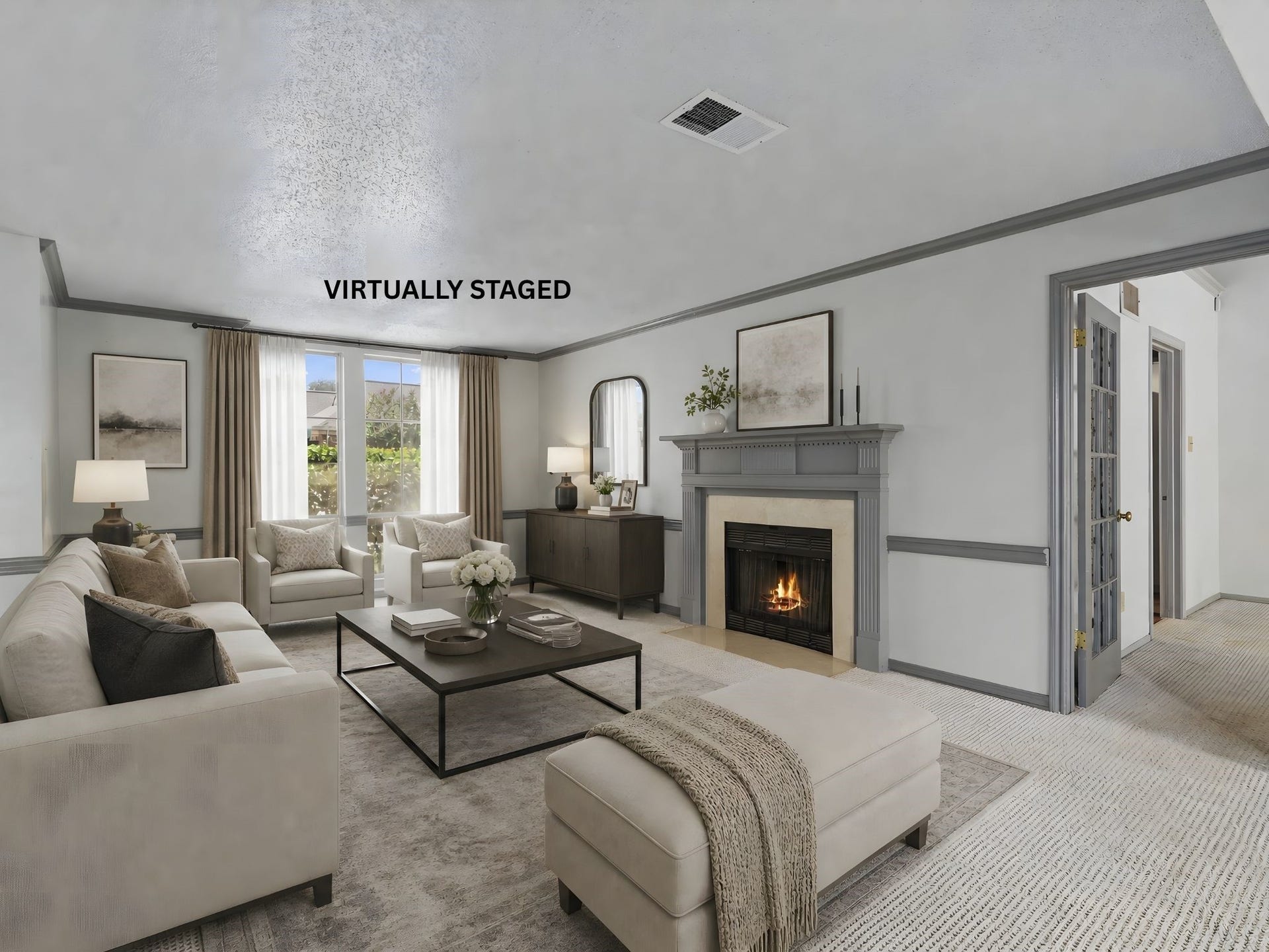 The virtually staged living room centered around the fireplace, highlighting a cozy focal point for relaxing evenings.