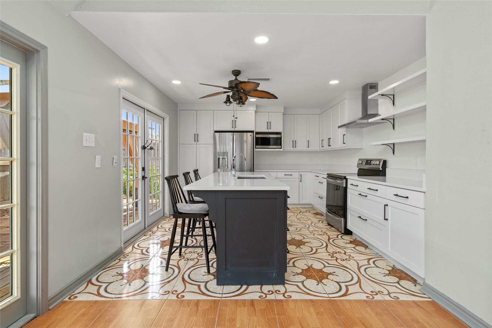 The kitchen island view, showing how this space serves as a natural gathering spot for casual meals or morning coffee.