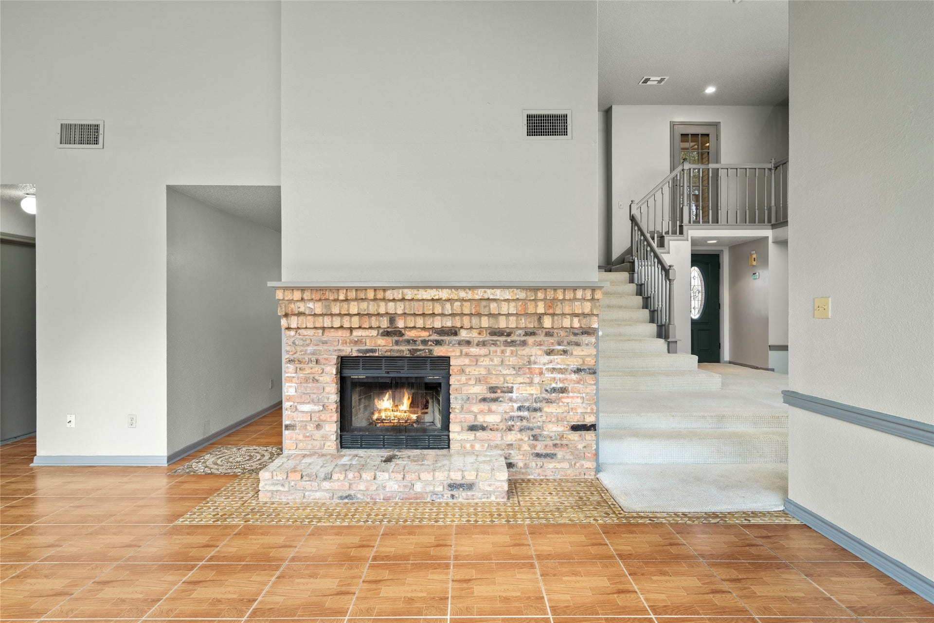 Another look at the fireside living space, emphasizing the warmth and character the fireplace brings to daily living.