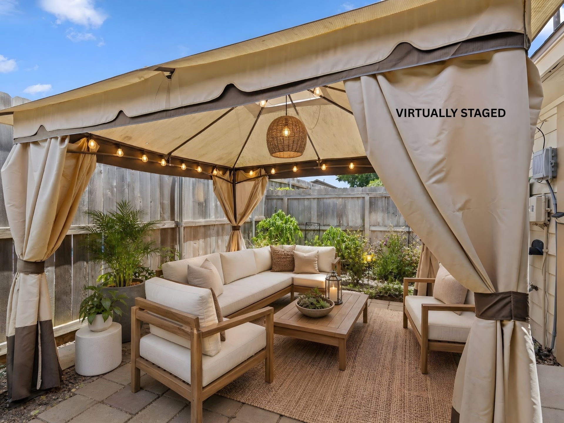 The virtually staged covered patio, illustrating how this space can be transformed into a stylish outdoor living and lounging area.