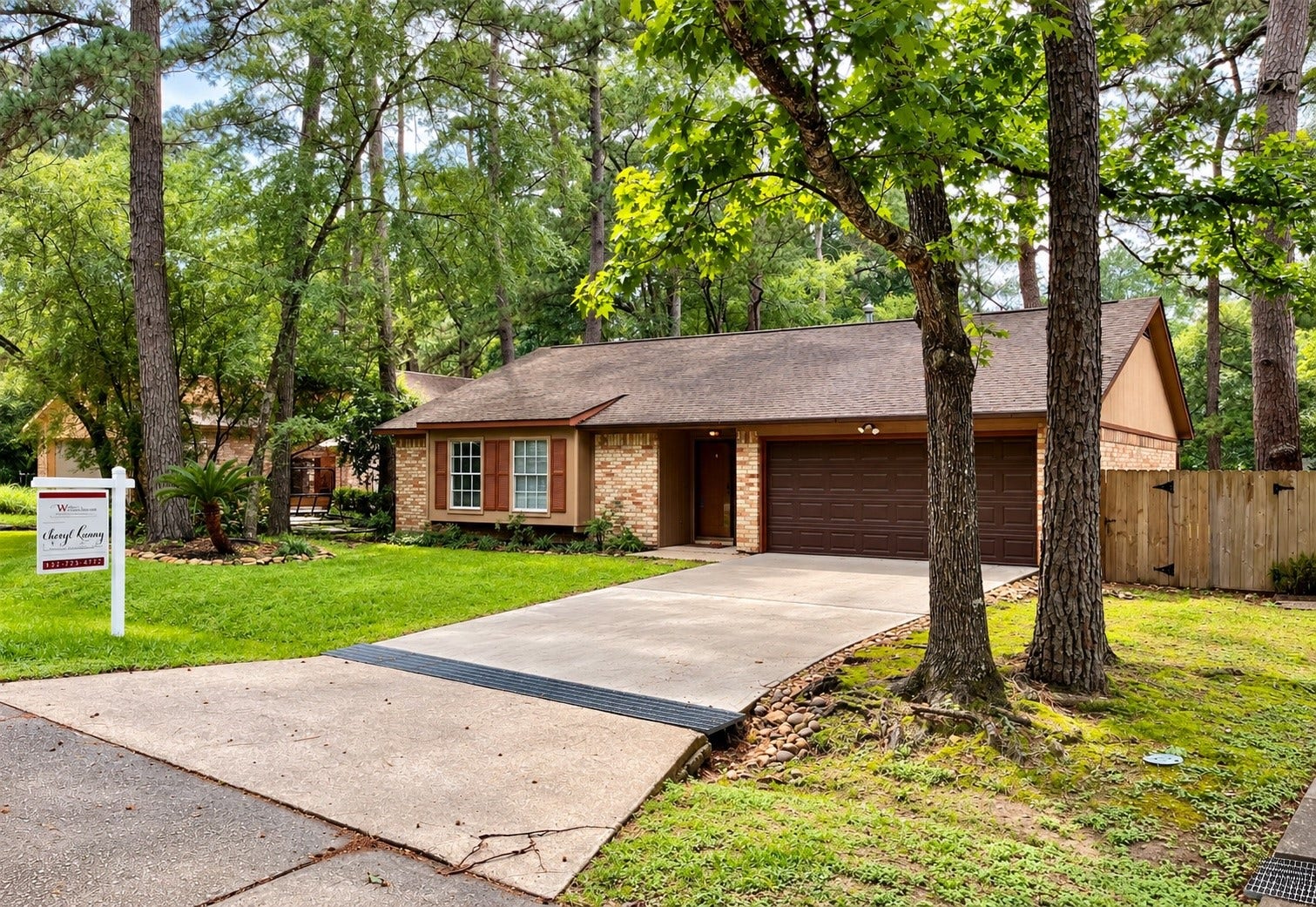 6 Leverwood Court, The Woodlands, TX 77381 Another perspective of the home's attractive setting on a wooded cul-de-sac.