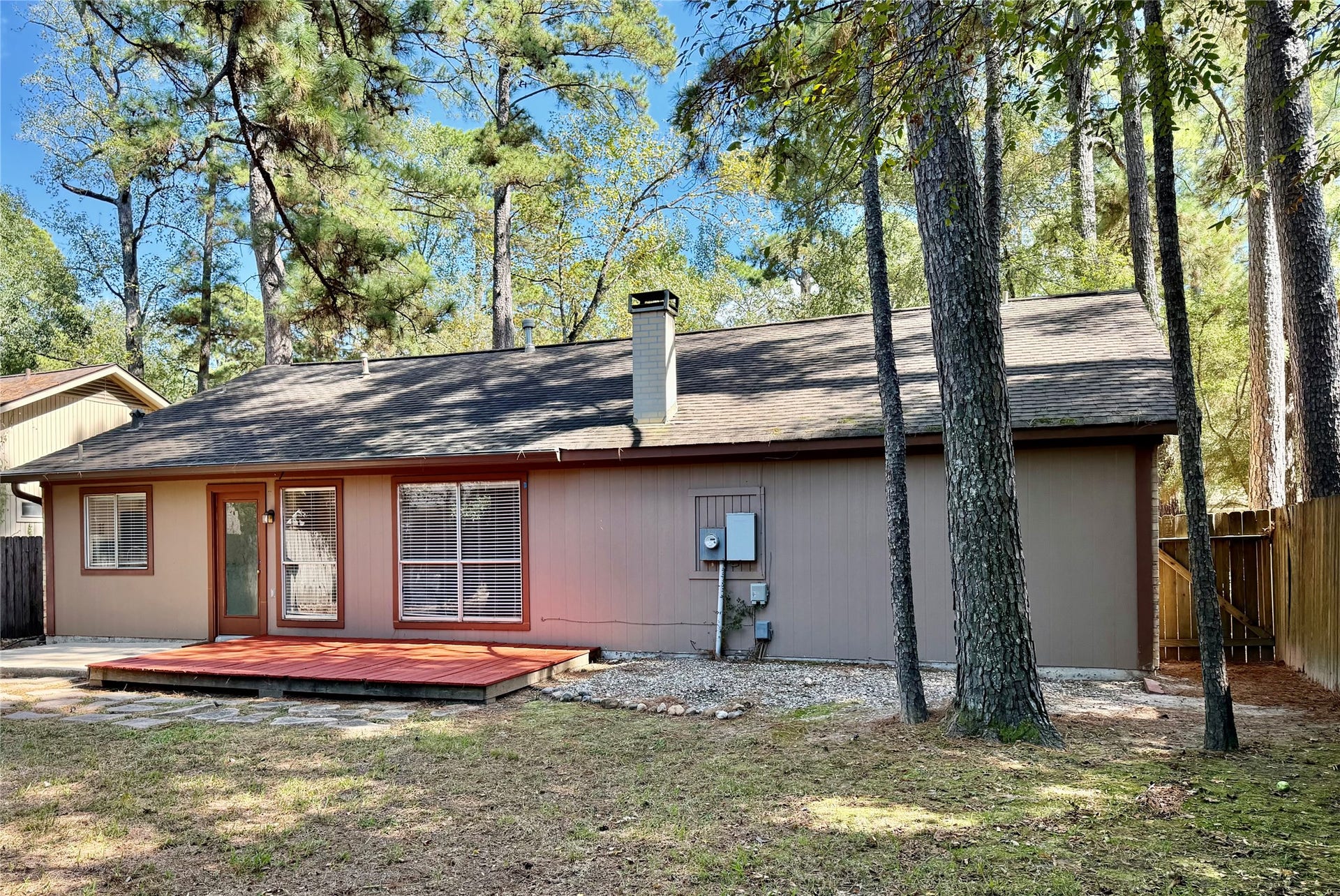 6 Leverwood Court, The Woodlands, TX 77381 Quiet, fully fenced backyard with mature trees and a peaceful wooded setting.
