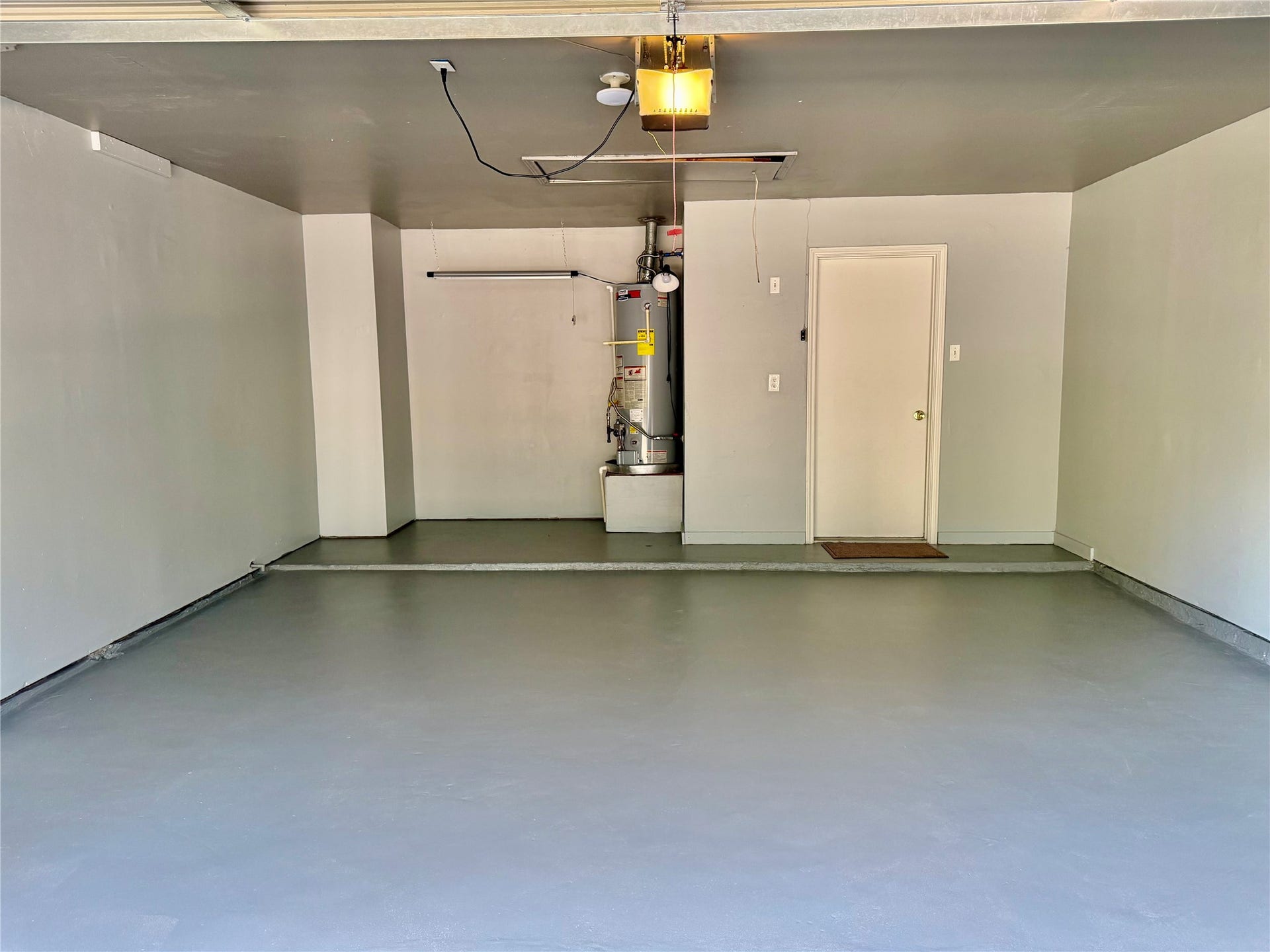 6 Leverwood Court, The Woodlands, TX 77381 Spacious garage with additional room for storage or a workshop area.