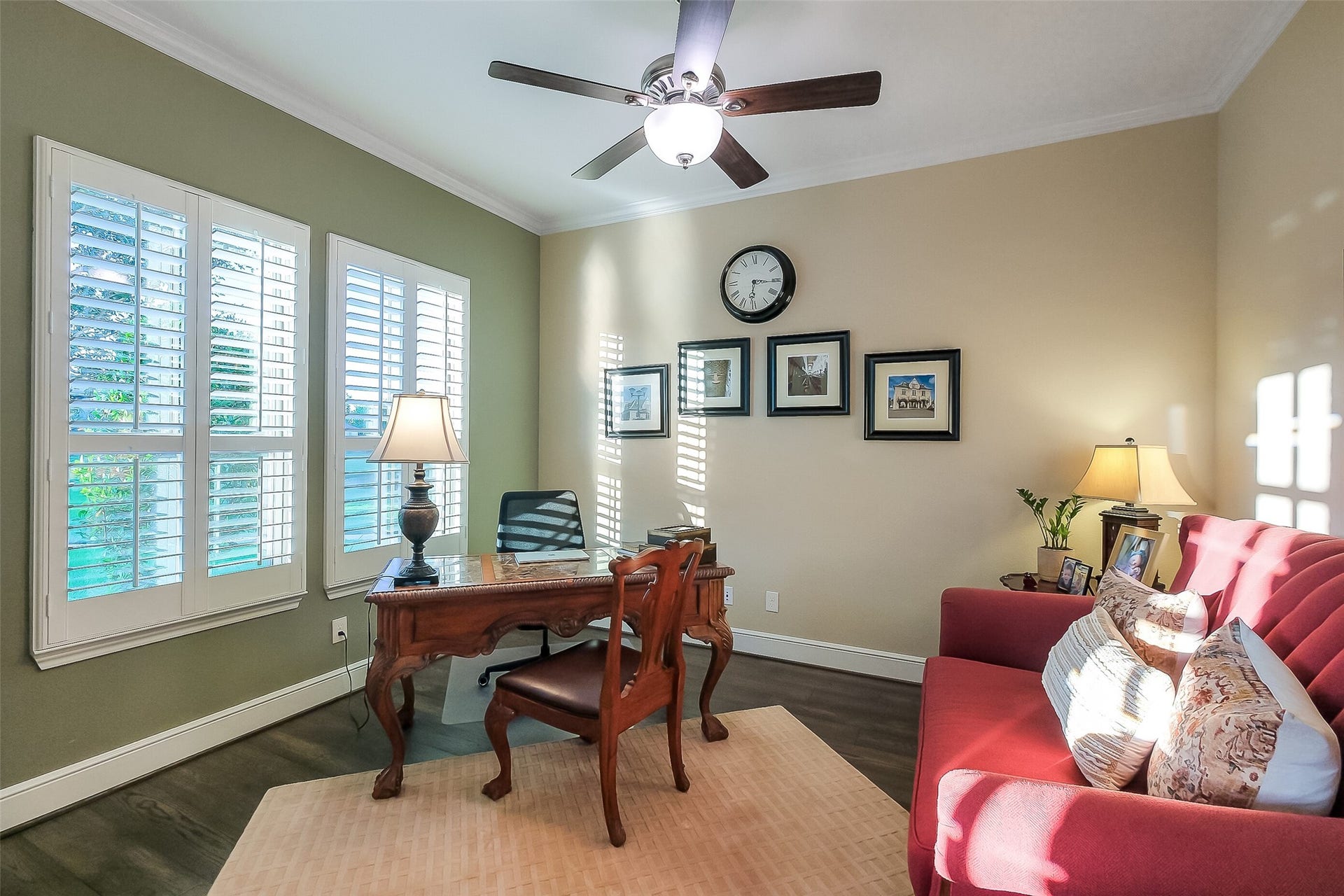 Working from home is a pleasure when overlooking the front cul-de-sac landscaping and tucked behind plantation shutters. Glass french doors separate this cozy workspace from the main house when you need privacy.