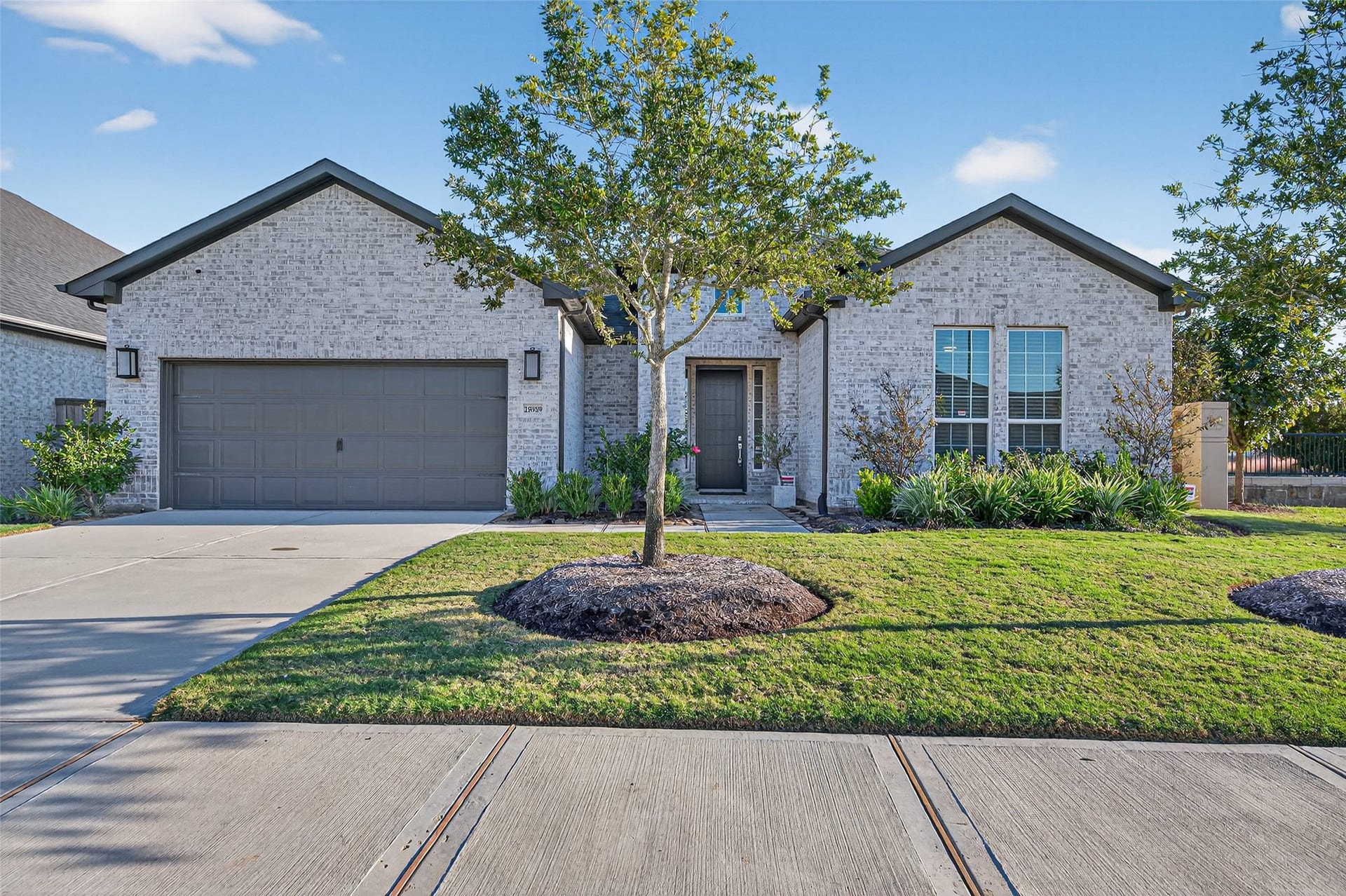 28939 Shady Grove Lane, Fulshear, TX 77441 This stunning Wedgewood floorplan showcases timeless brickwork and meticulous landscaping, creating a warm and welcoming curb appeal.