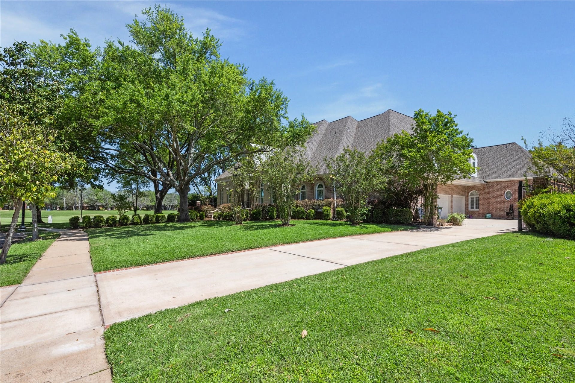 38 Scotsmoor Court, Sugar Land, TX 77479 Enjoy no neighboring residence allowing for unobstructed views of the Sweetwater golf course