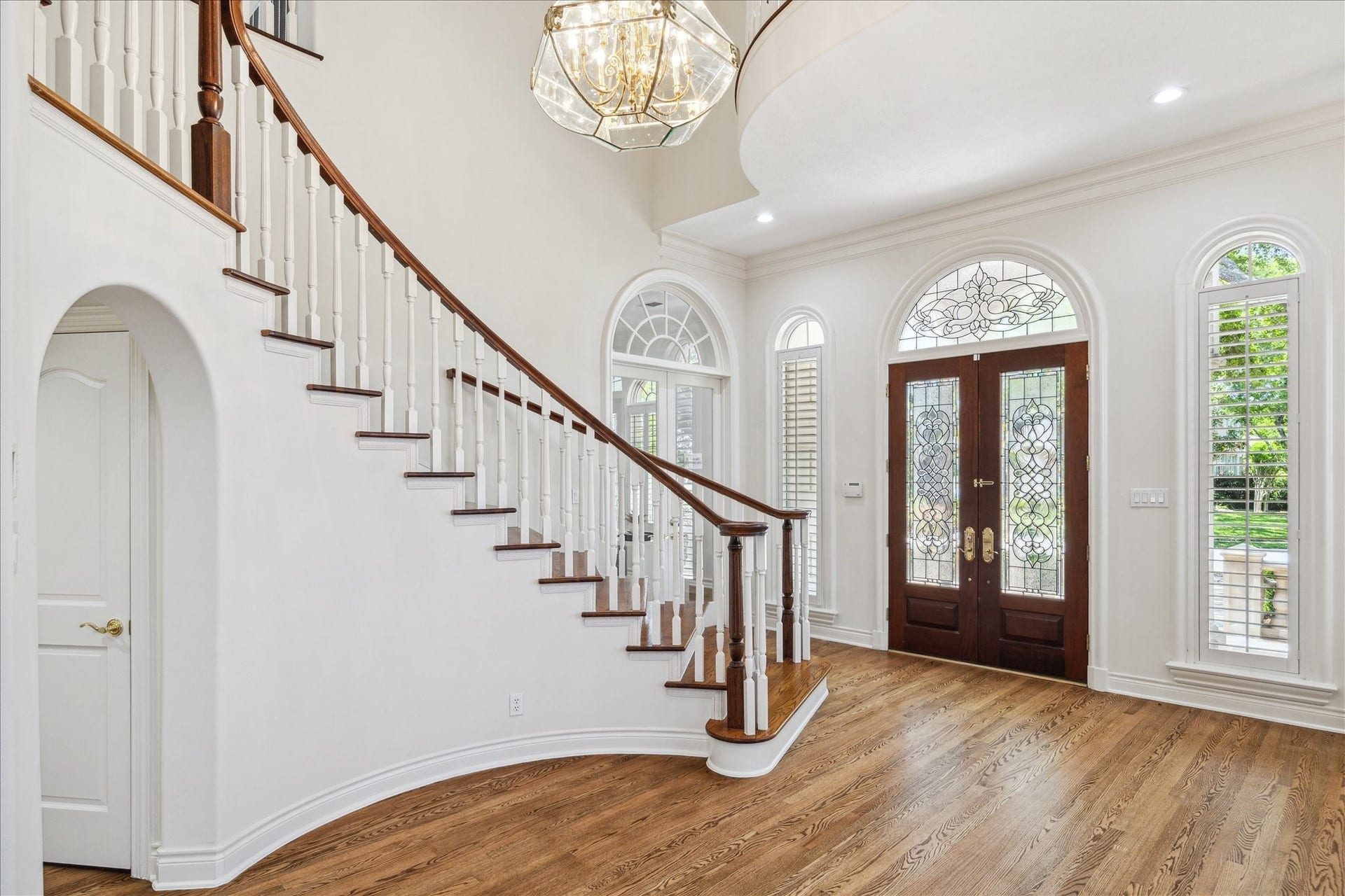 38 Scotsmoor Court, Sugar Land, TX 77479 Enter the home through a set of solid wood leaded glass doors.